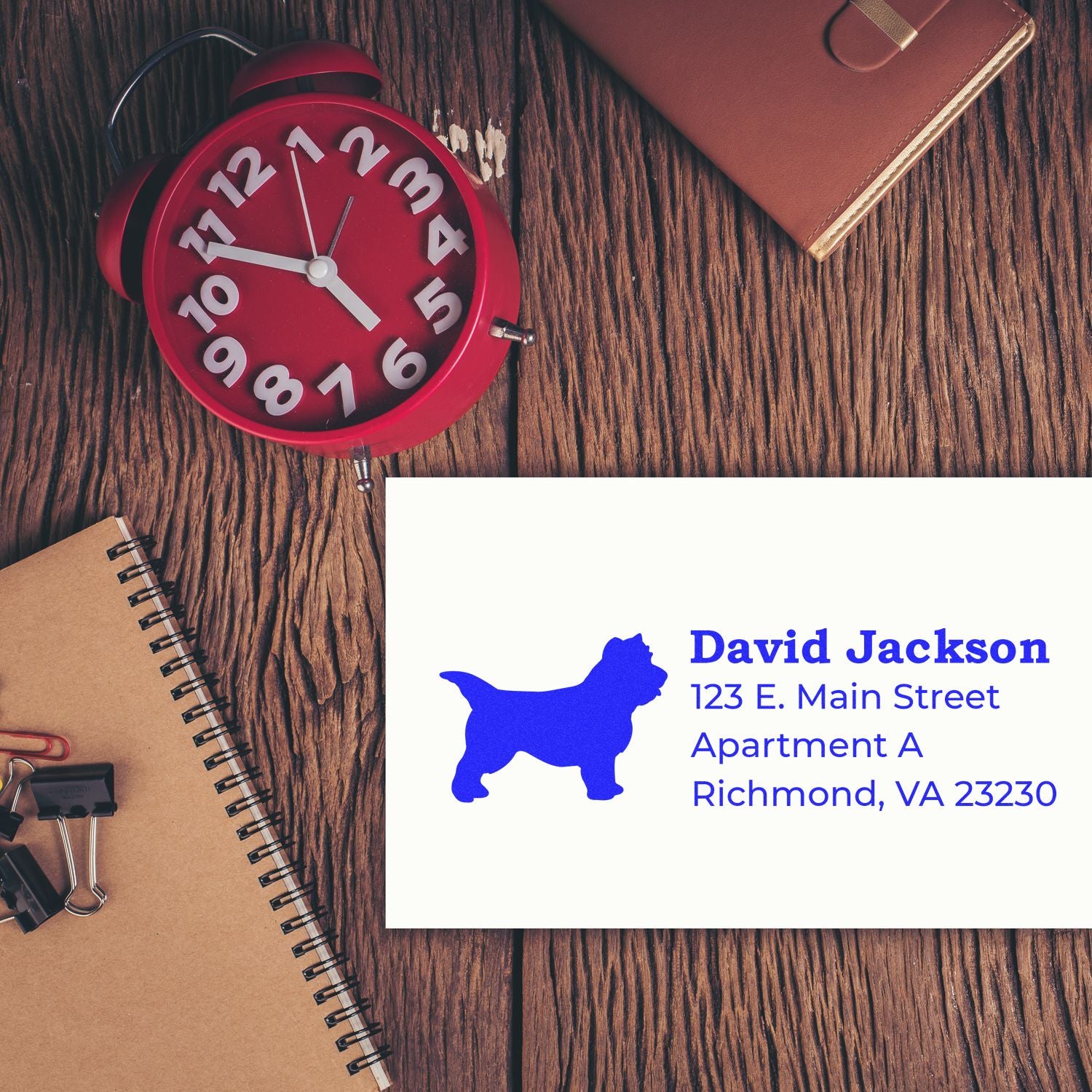 Custom return address rubber stamp with dog silhouette, personalized name, and Richmond, VA address for mailing.