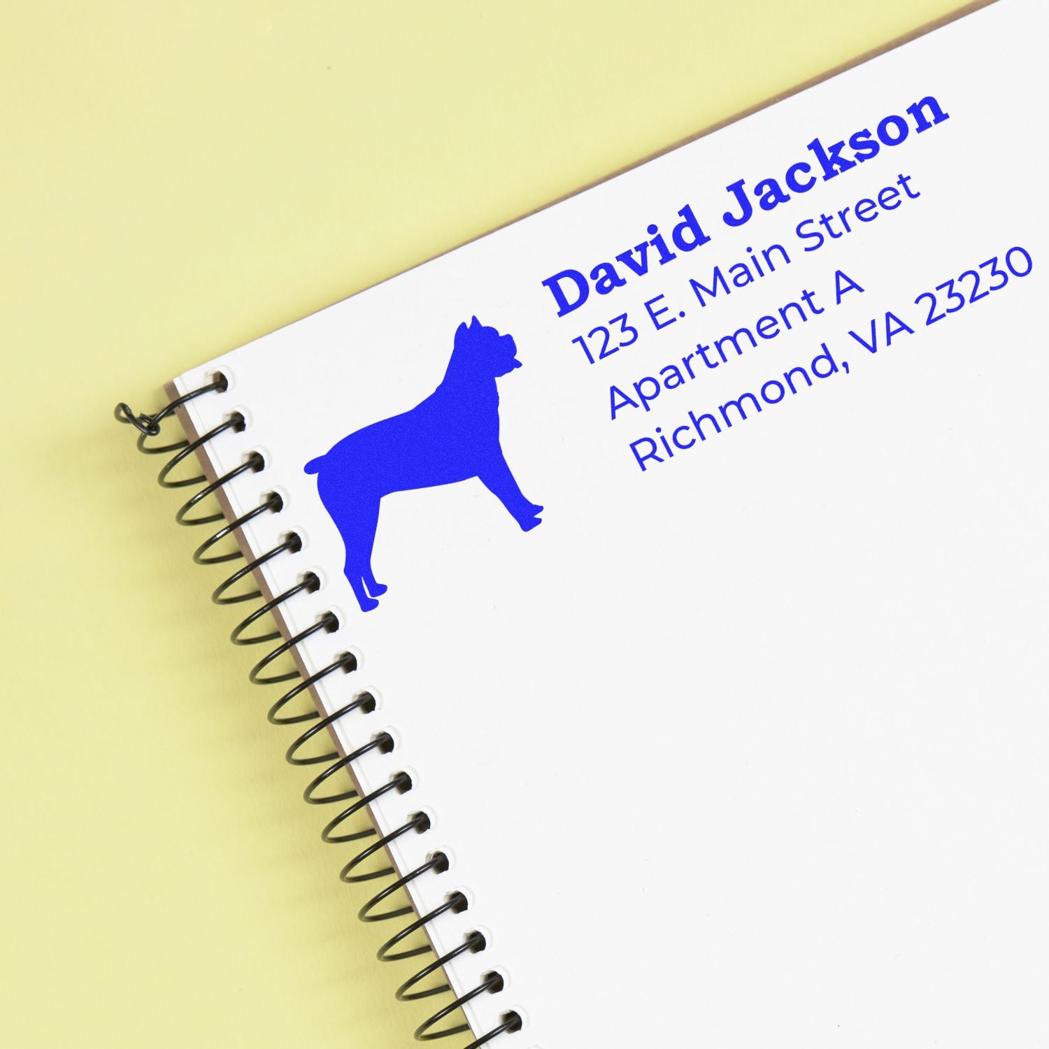 Personalized rubber address stamp with blue dog silhouette, name, and mailing address for custom pet-themed stationery.