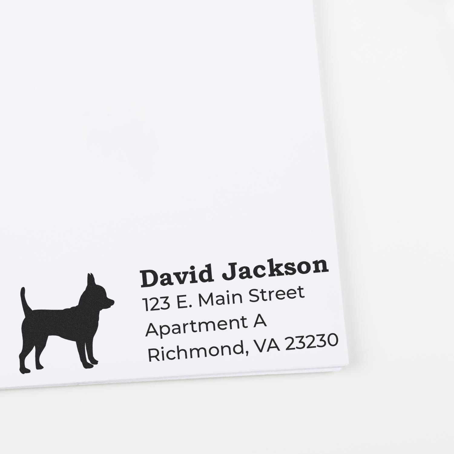 Custom return address rubber stamp with dog silhouette for personalized envelopes, showing David Jackson in Richmond, VA.