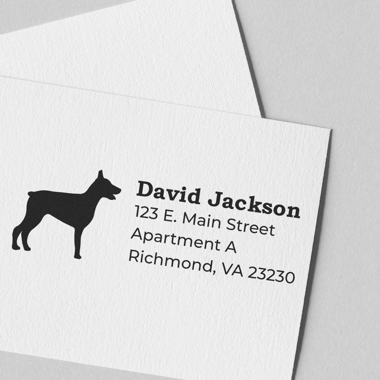 Custom return address rubber stamp with dog silhouette for envelopes, featuring David Jackson, Richmond, VA.