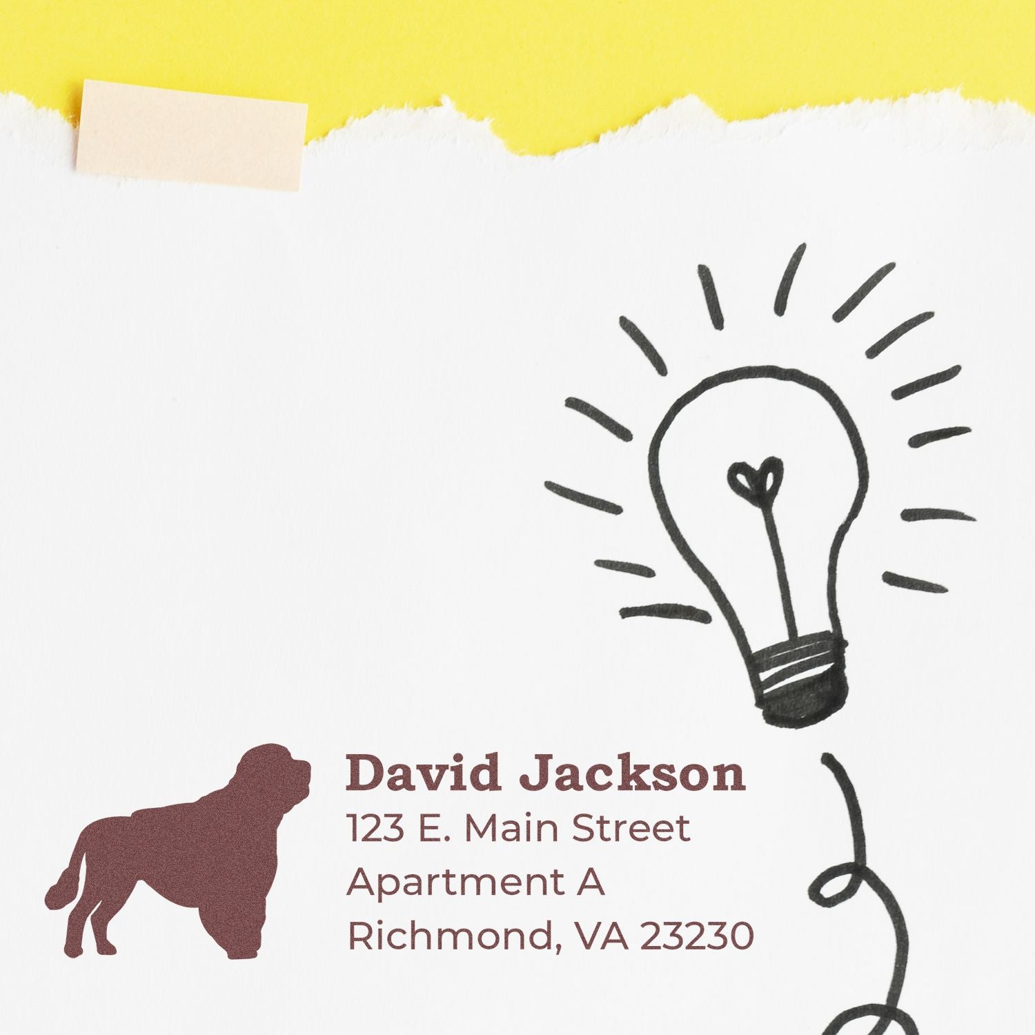 Custom rubber return address stamp with dog silhouette and lightbulb design for personalized mailing and packaging.