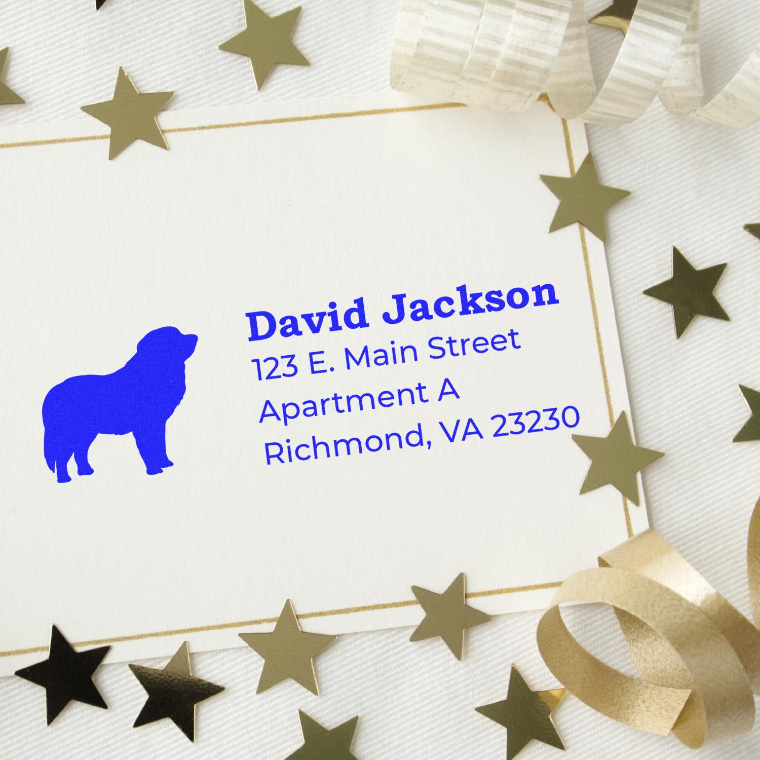 Custom rubber address stamp with bear logo and blue return address for David Jackson, styled on a gold star card.