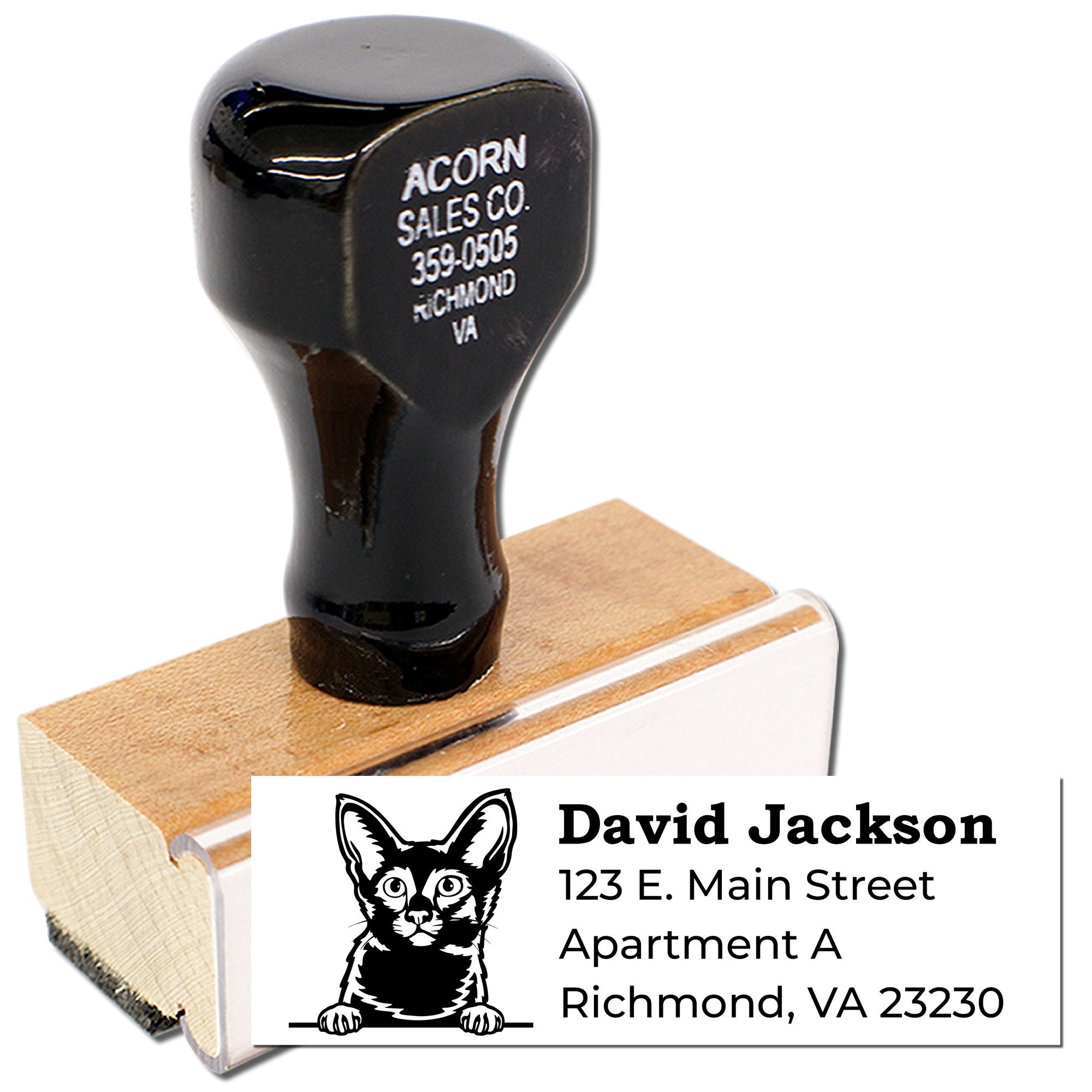 Personalized rubber address stamp with cat logo and return address for mailing envelopes.