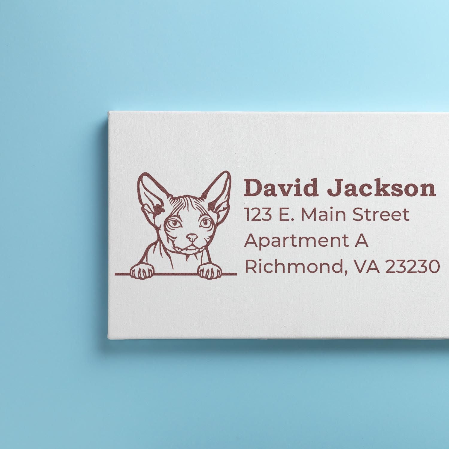 Custom return address rubber stamp with dog illustration, personalized name, and mailing address