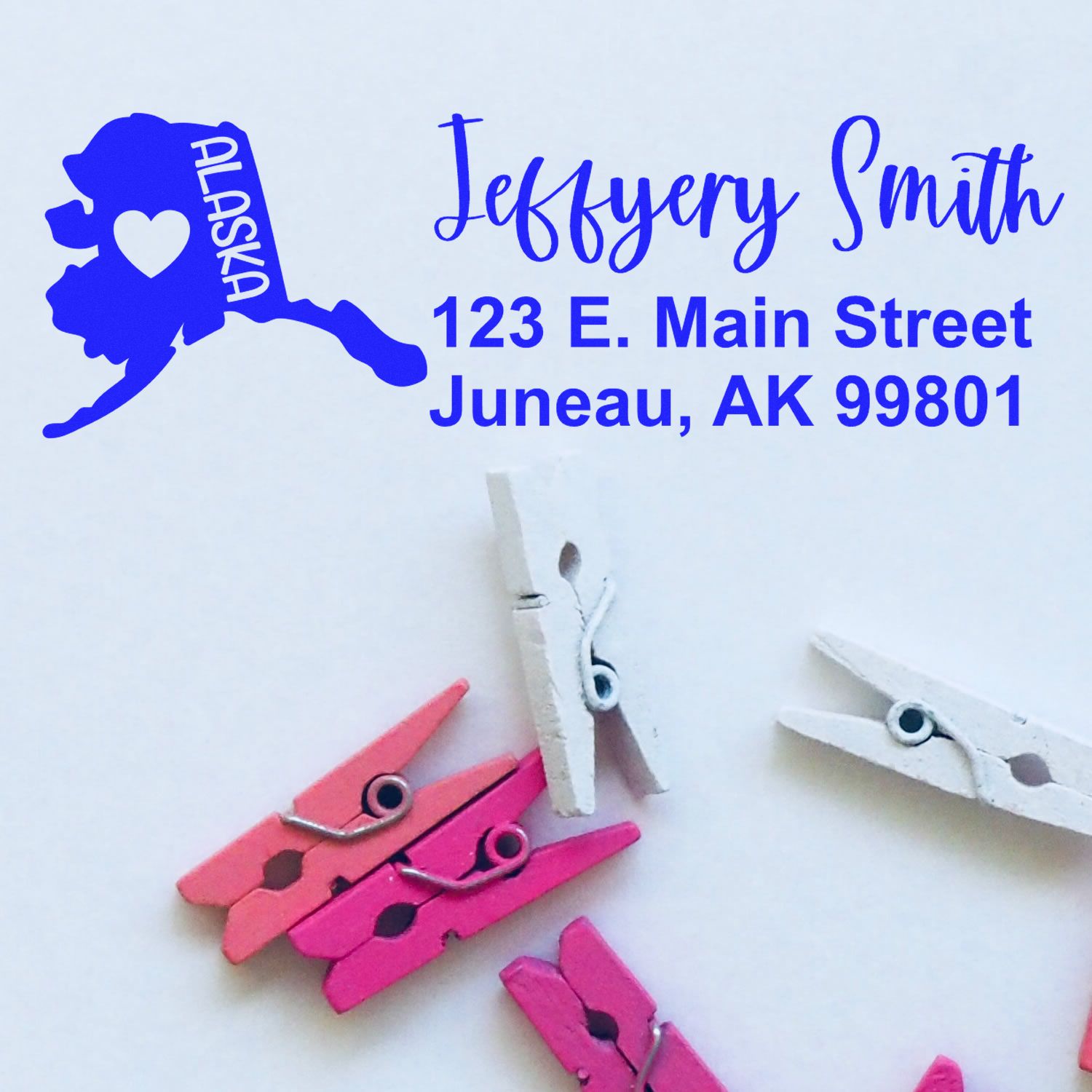 Custom Alaska return address rubber stamp with personalized name, logo, and Juneau, AK 99801 address for Jeffrey Smith.