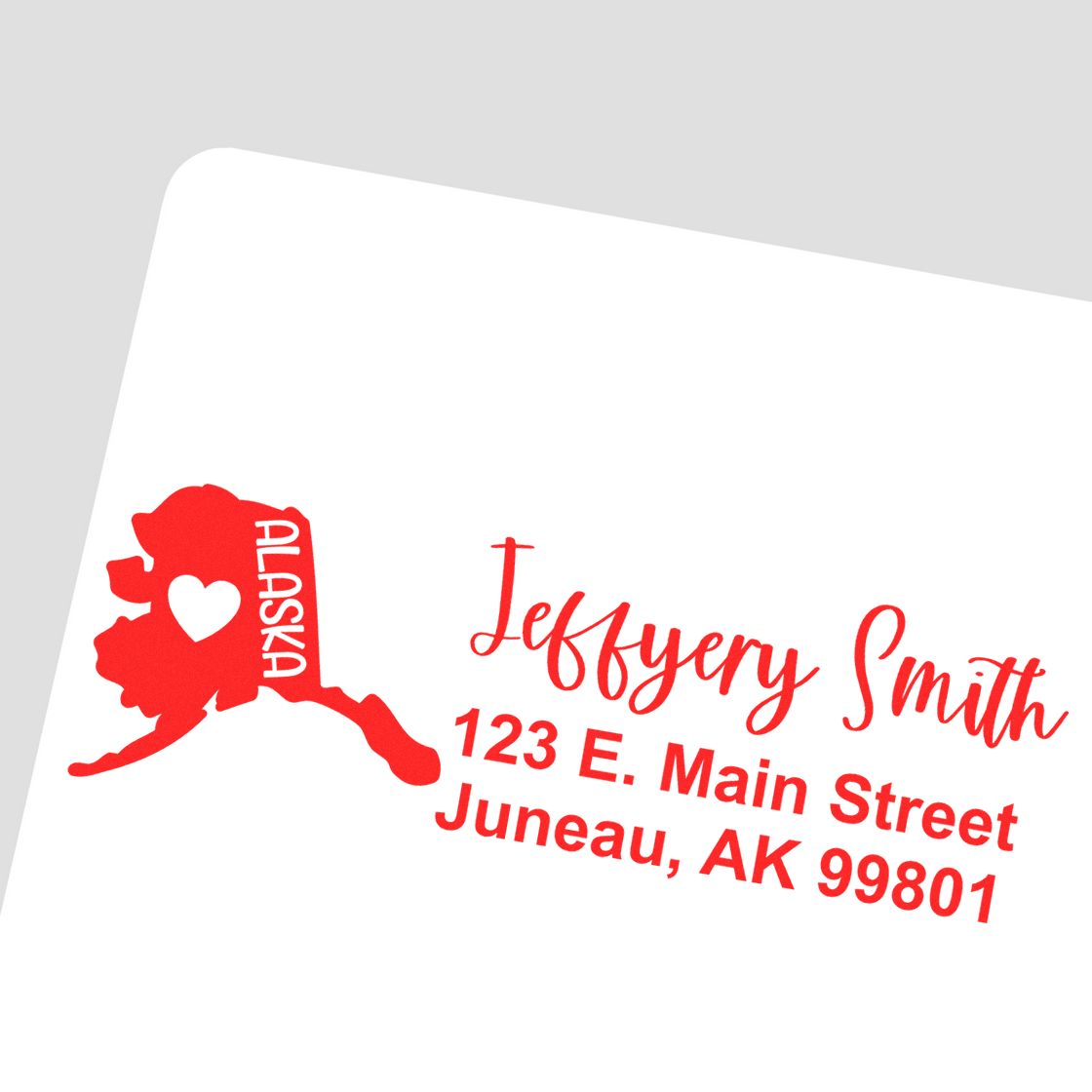 Custom Alaska return address rubber stamp featuring state silhouette and name/address for Jeffrey Smith, Juneau, AK.
