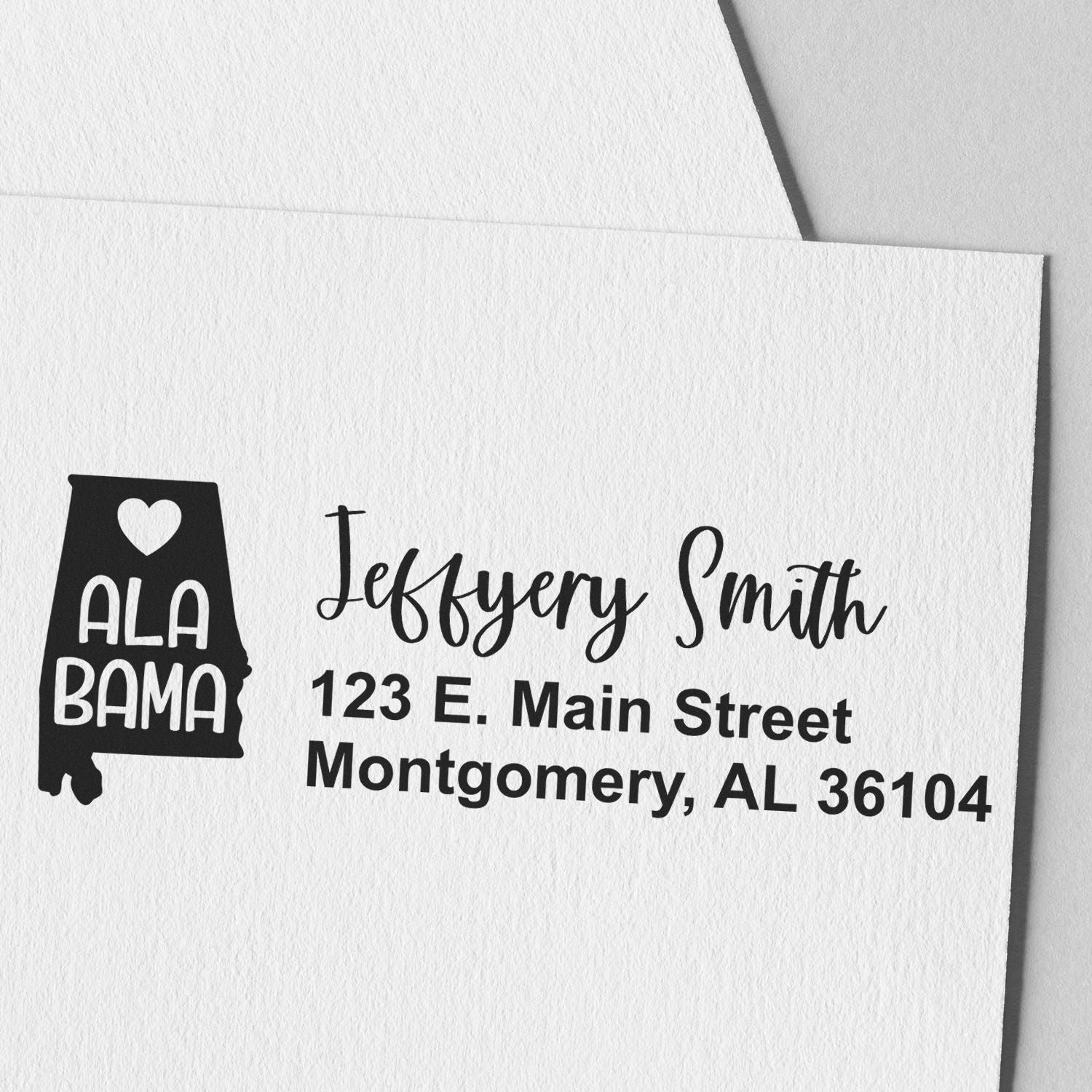 Custom Alabama return address rubber stamp for Jeffery Smith, 123 E. Main Street, Montgomery, AL 36104.