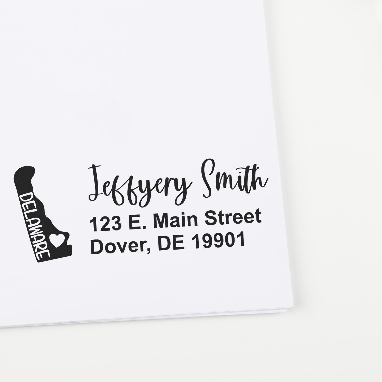 Personalized Delaware return address rubber stamp with name, street address, and Dover, DE 19901 imprint.