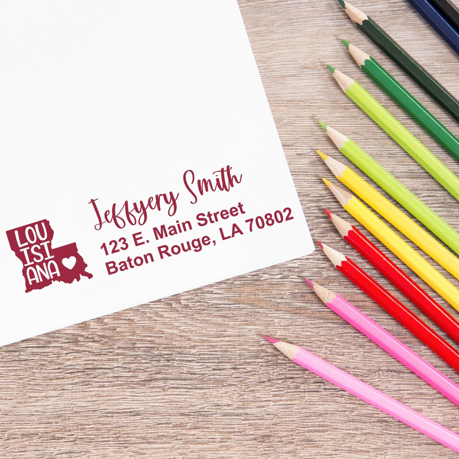 Custom Louisiana return address rubber stamp on paper, featuring a personalized Baton Rouge, LA 70802 stamp design.