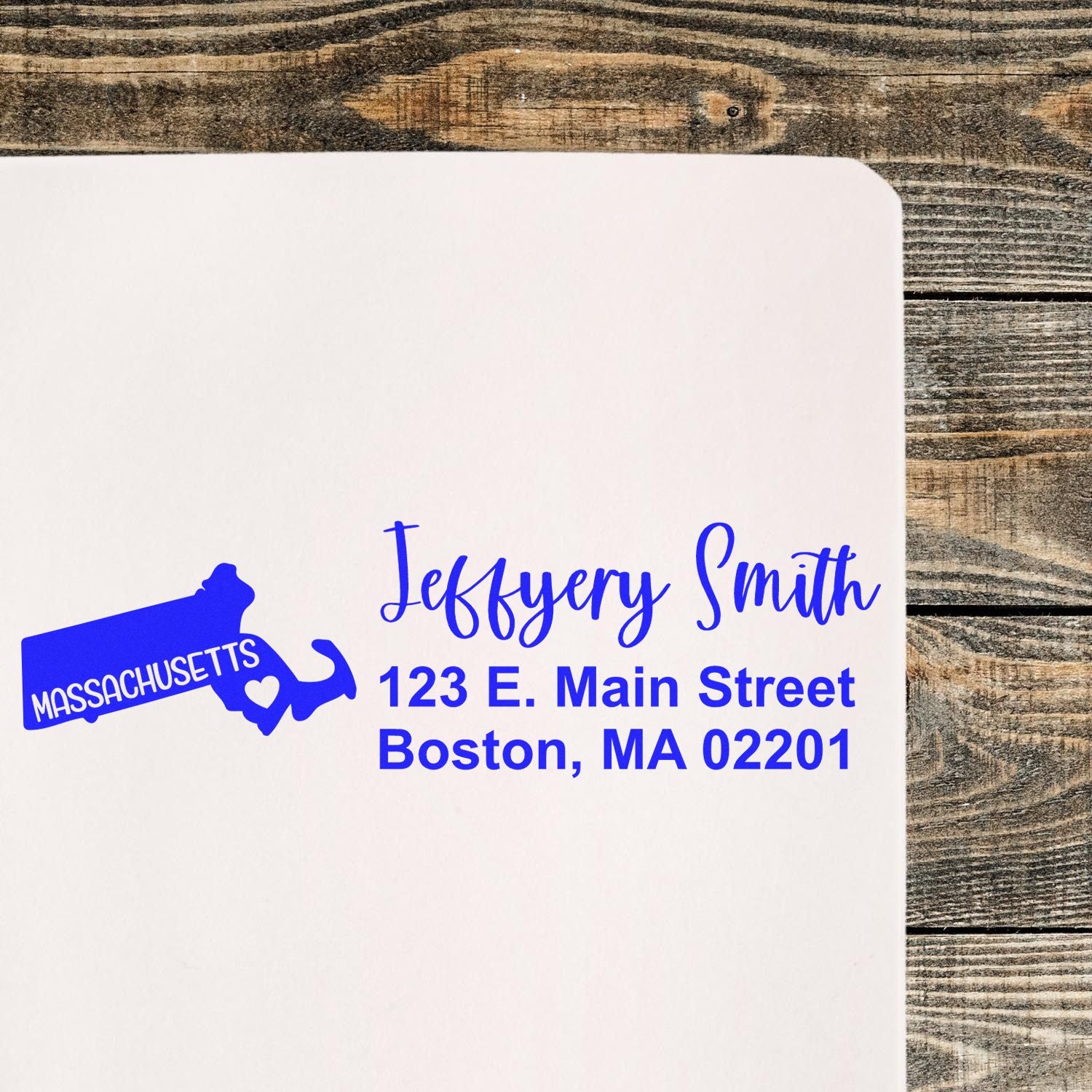 Custom Massachusetts return address rubber stamp with name, Boston address, and state outline in blue ink
