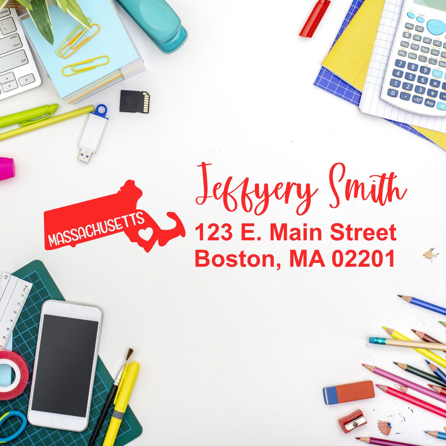 Custom Massachusetts return address rubber stamp with name and Boston address, styled on a stationery flat lay.