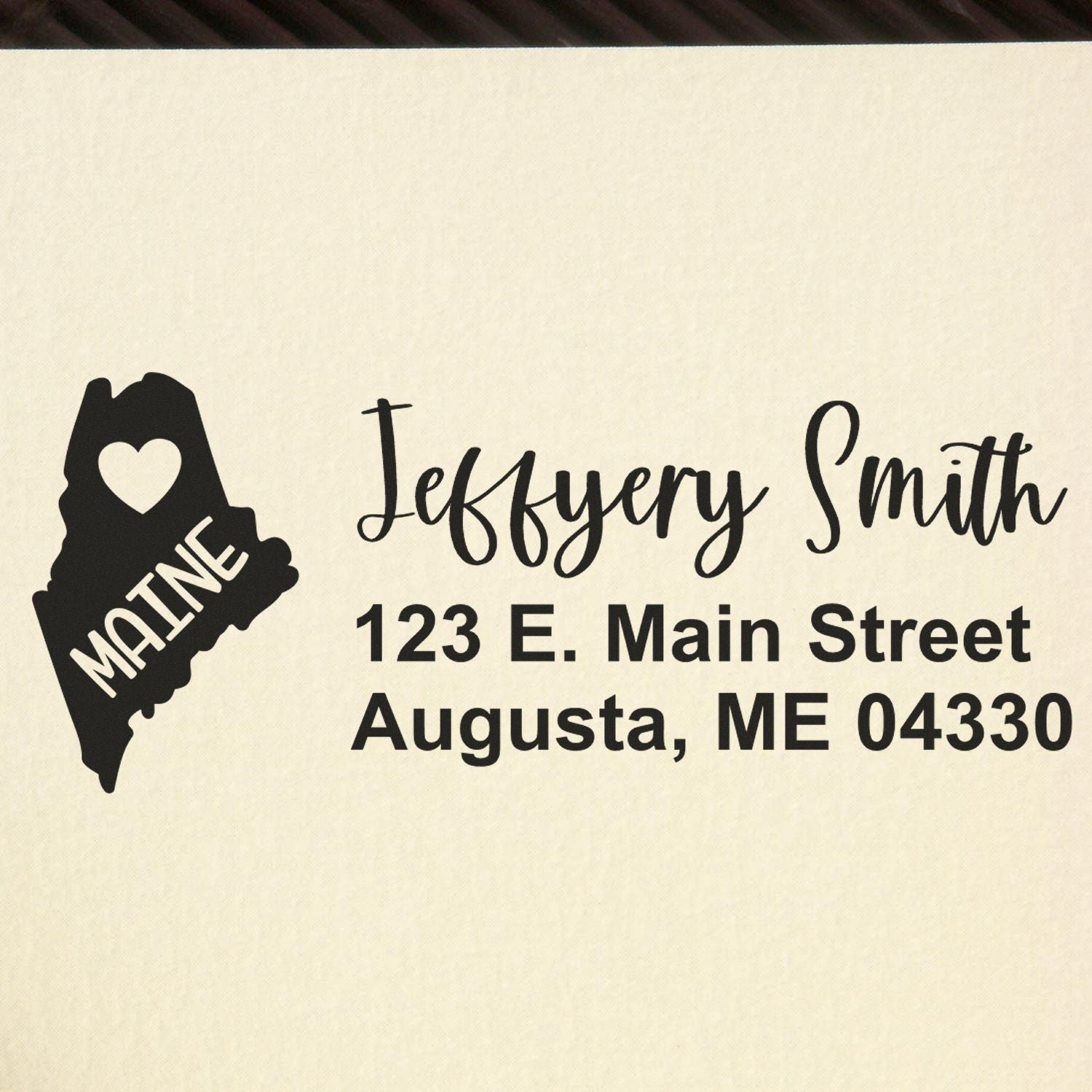 Custom Maine return address rubber stamp for Jeffery Smith, 123 E. Main Street, Augusta, ME 04330 with heart state design.
