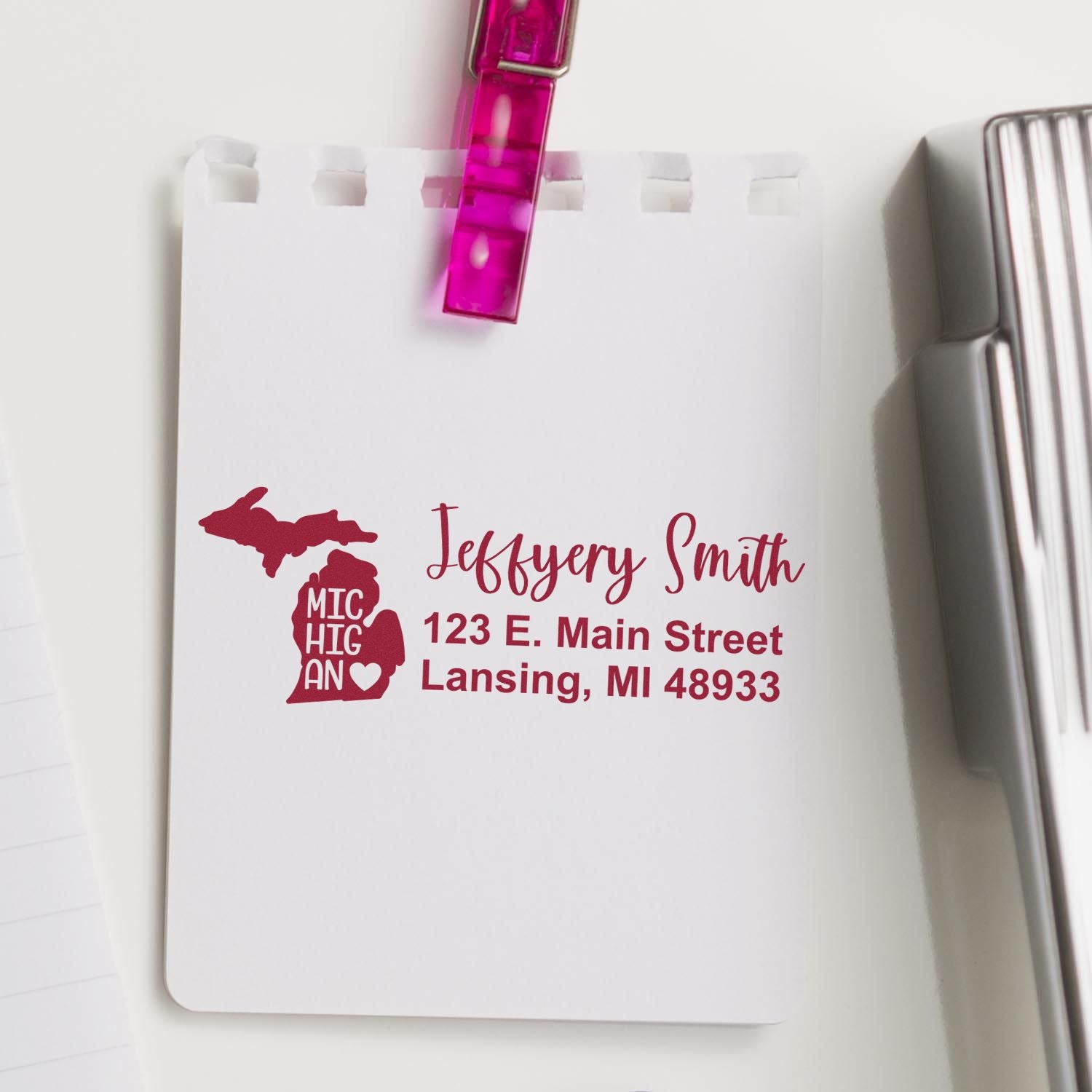 Custom Michigan return address rubber stamp with name and address on notepad for personalized envelopes and stationery.