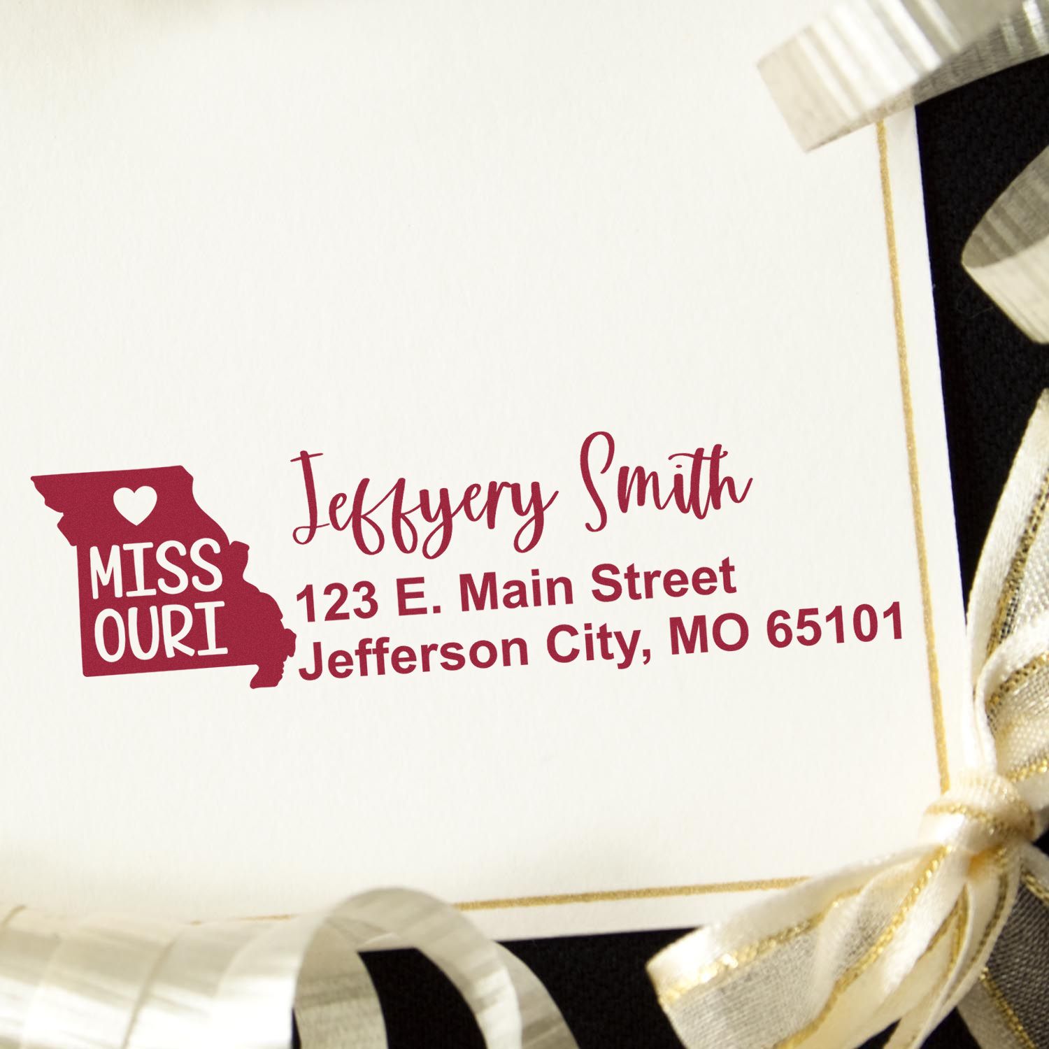 Custom Missouri return address rubber stamp with name, street address, and city state ZIP on a white envelope.