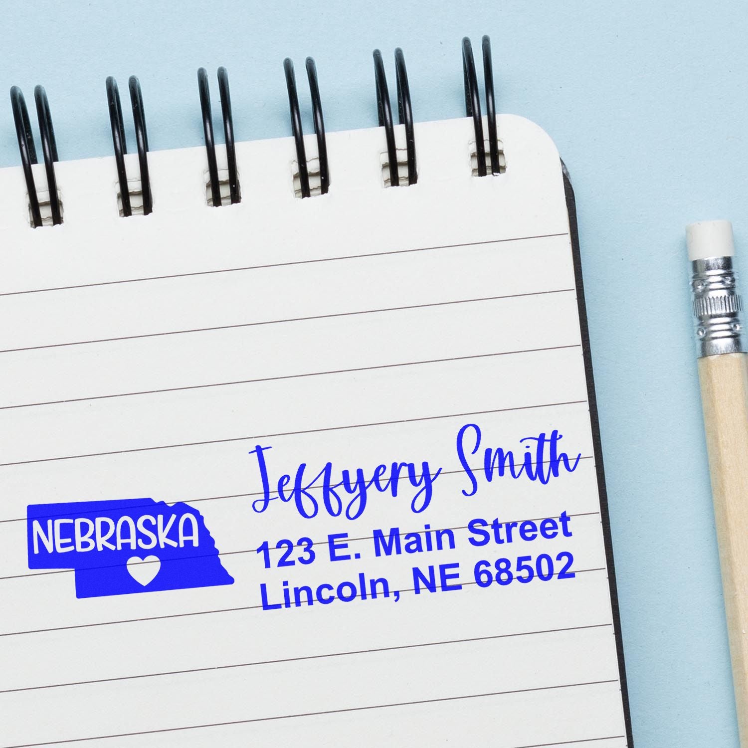 Custom Nebraska return address rubber stamp with name and Lincoln, NE details for personalized mailing and branding.