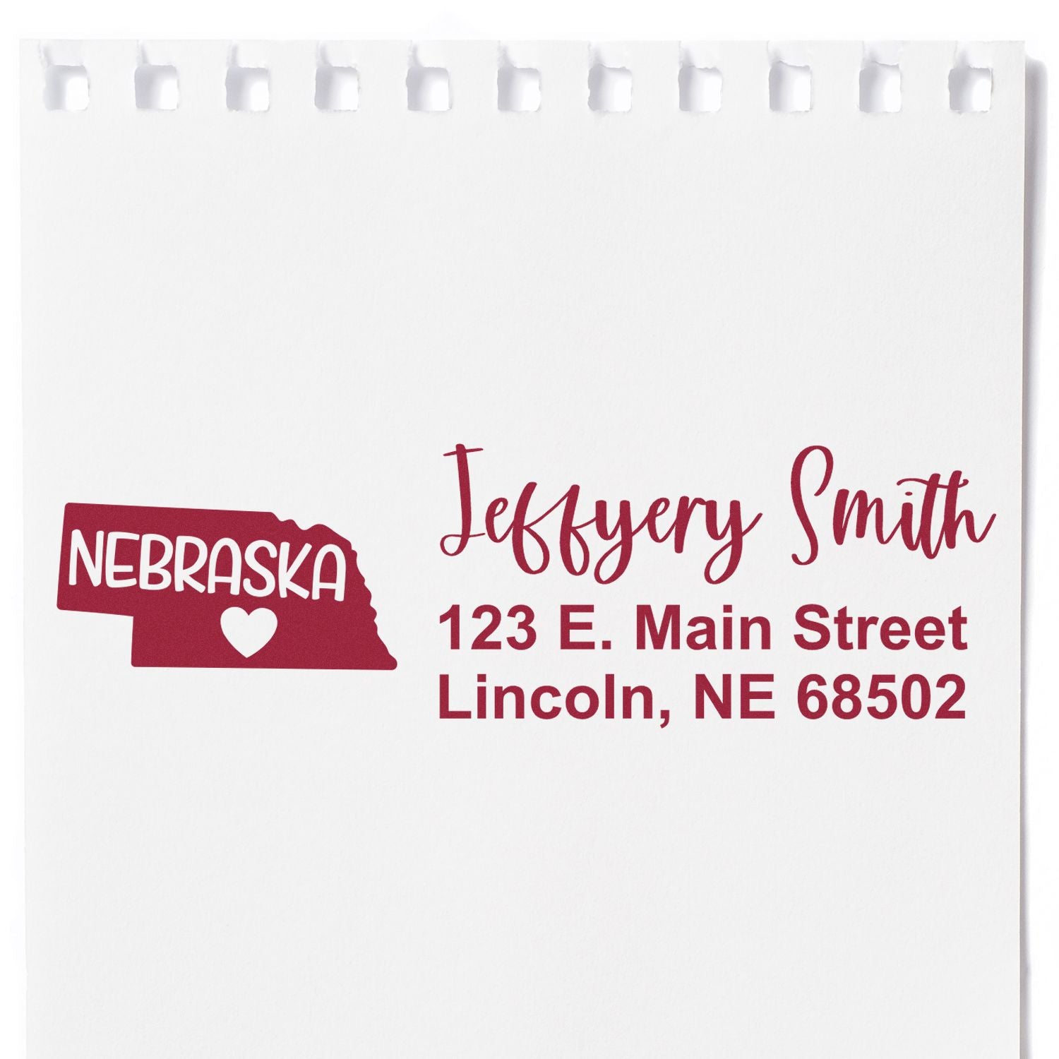 Custom Nebraska address rubber stamp with Jefferson Smith, 123 E. Main Street, Lincoln, NE 68502 for personalized mailing.