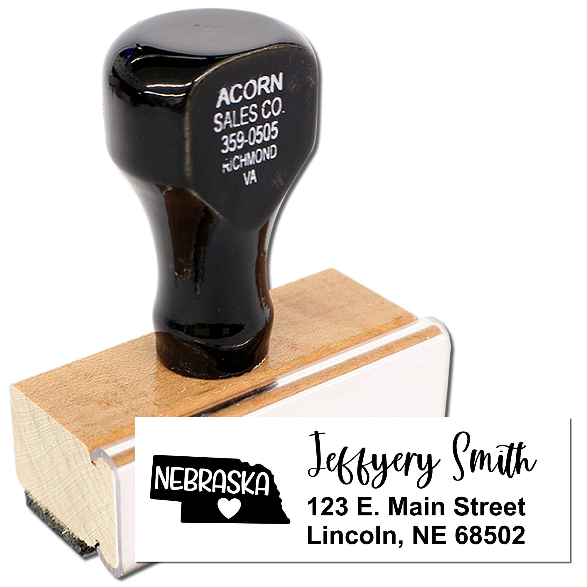 Personalized rubber address stamp with Nebraska state design, name, and mailing address for custom business use.