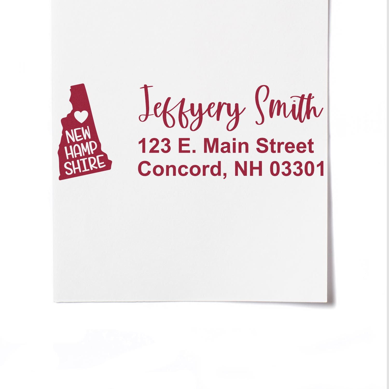 Custom return address rubber stamp with New Hampshire state design for Jeffrey Smith, 123 E. Main Street, Concord, NH 03301