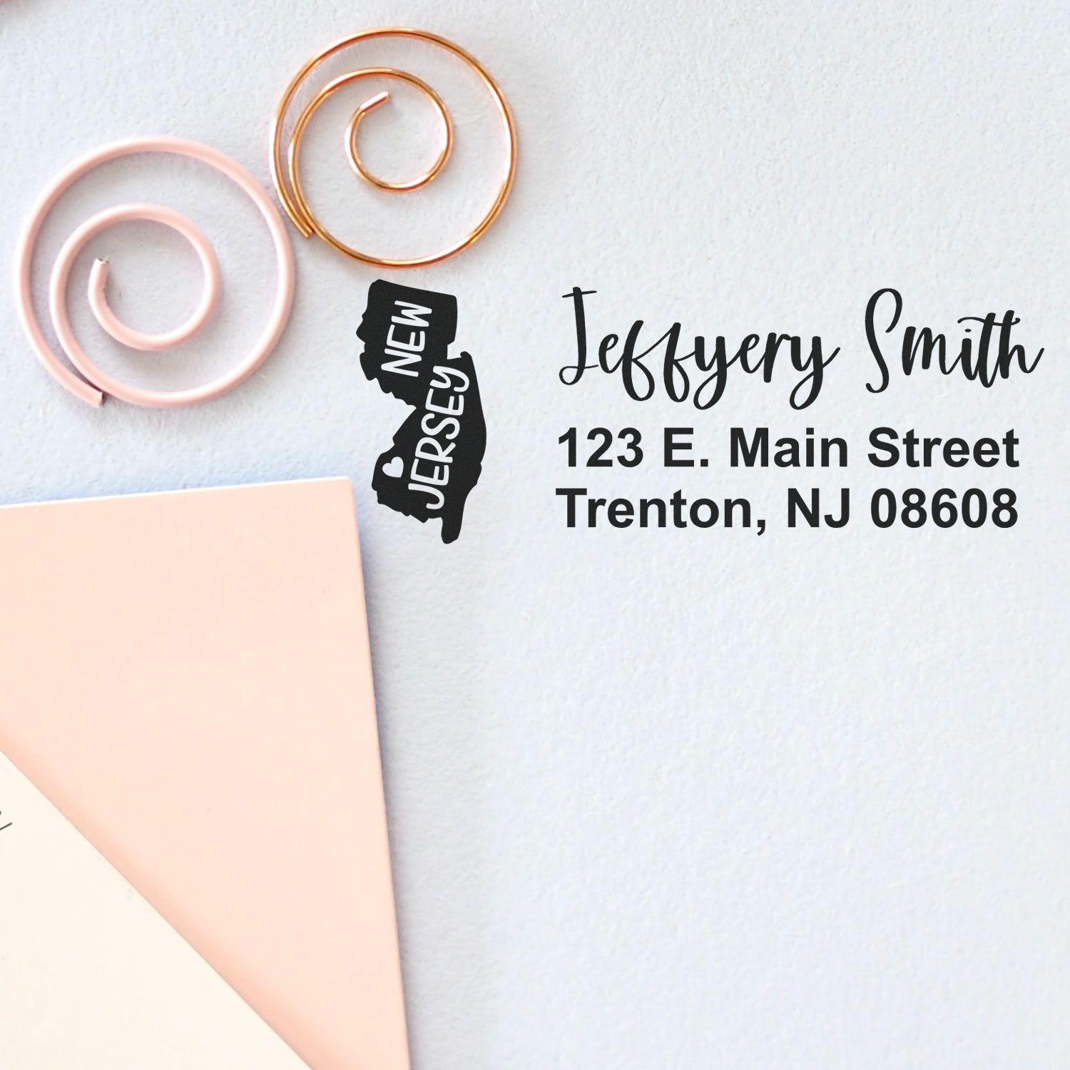 Personalized return address rubber stamp with New Jersey design, name, and mailing address for invitations and business mail.
