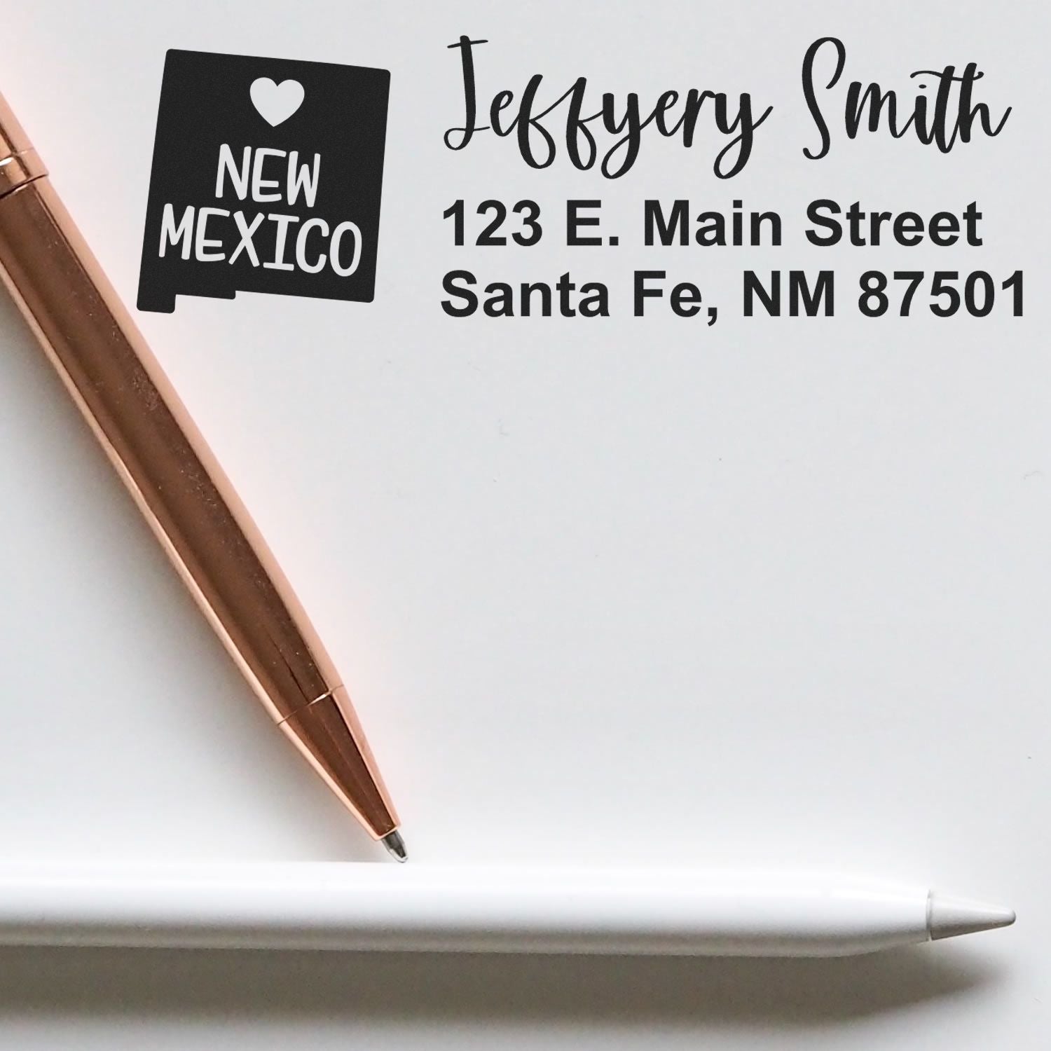 Personalized return address rubber stamp with New Mexico state icon, Jeffery Smith name, and Santa Fe, NM mailing address.
