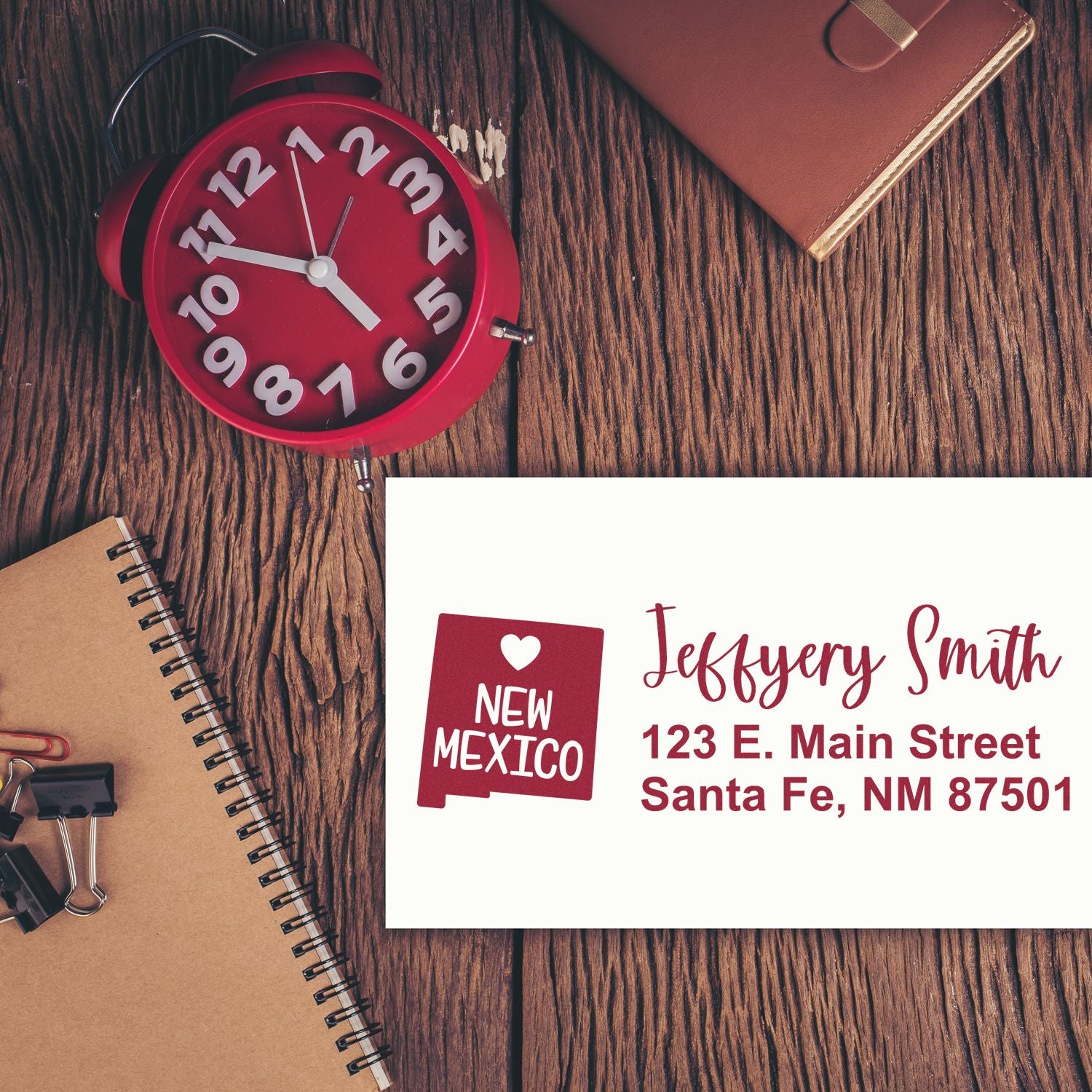 Personalized return address rubber stamp with New Mexico design, shown on a custom stationery card for mailing and branding.