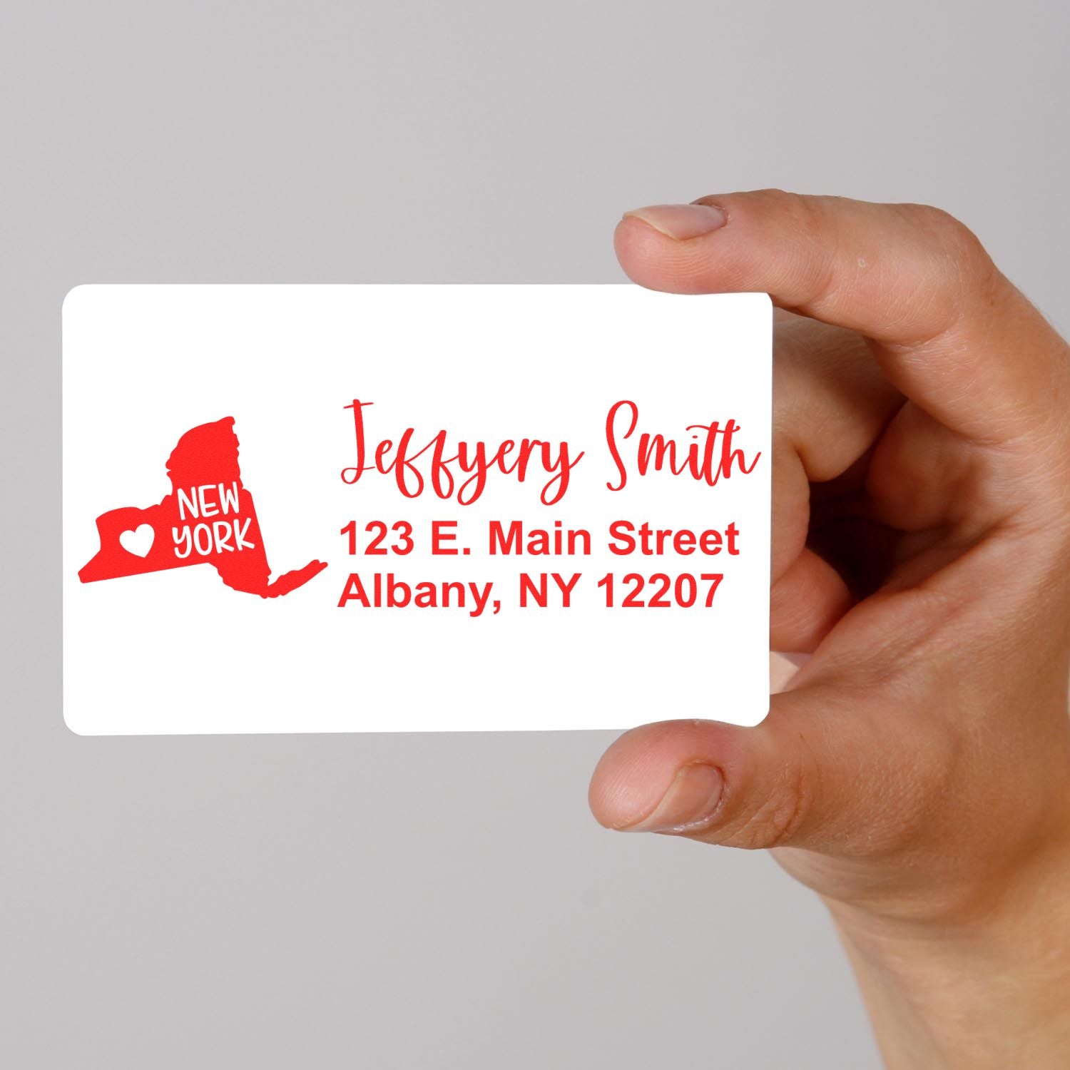 Custom return address rubber stamp with New York design and Jeffery Smith Albany, NY address.
