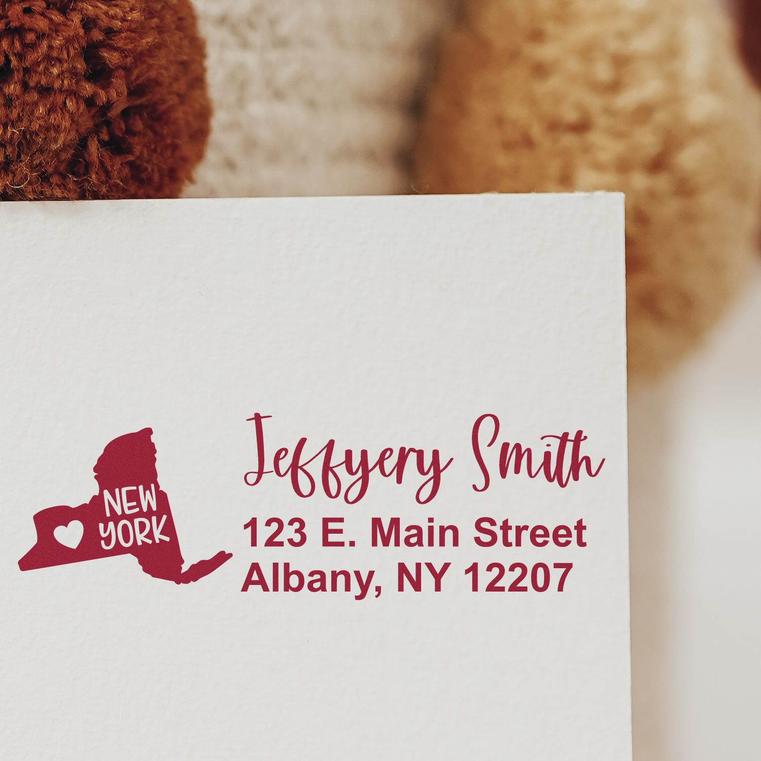 Custom New York return address rubber stamp with name and Albany, NY address for envelopes and mailings.