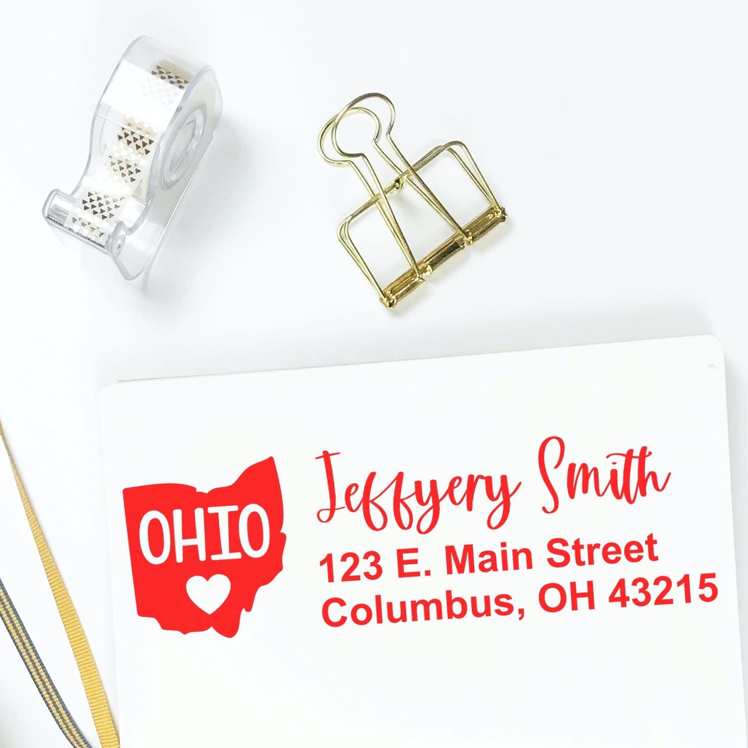 Personalized Ohio return address rubber stamp with name and Columbus address for custom envelope mailing.