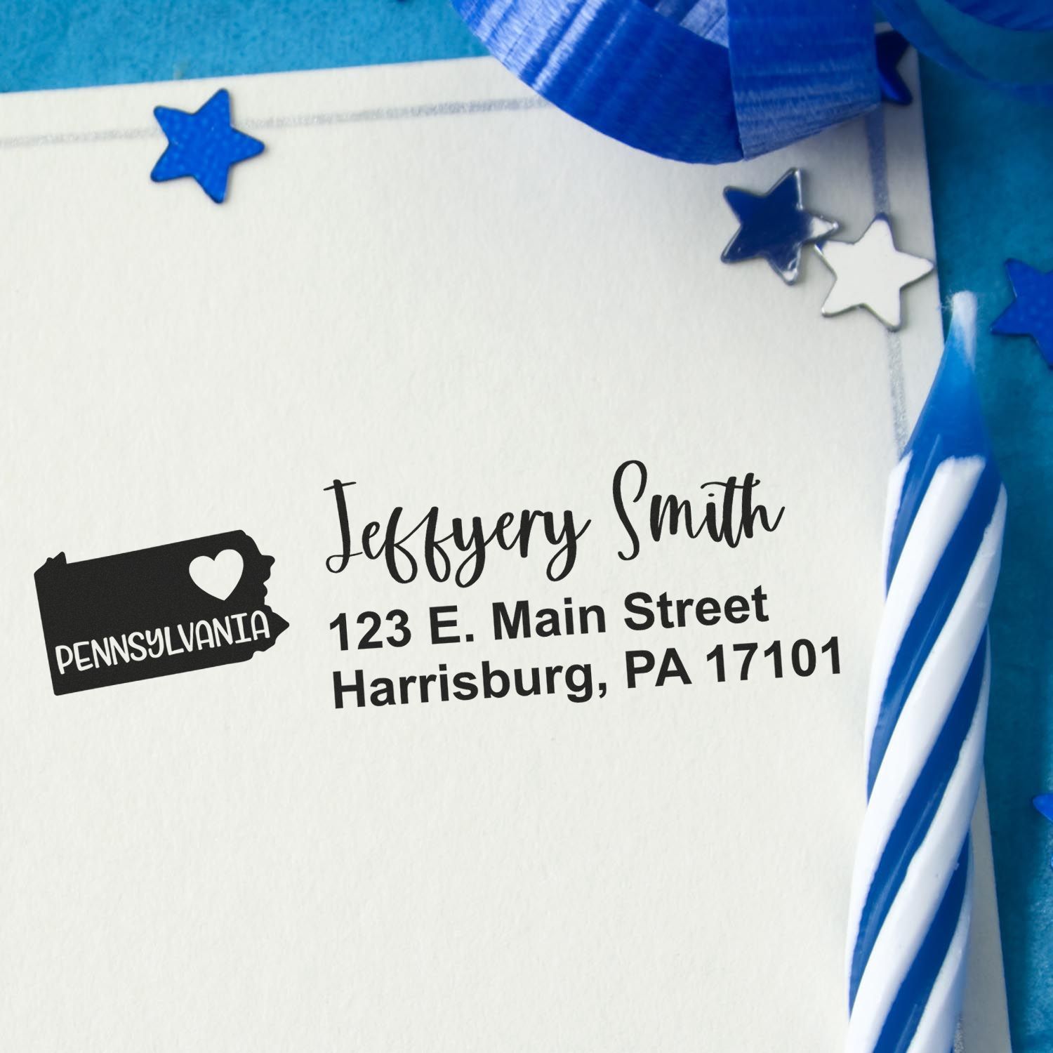 Personalized rubber stamp return address for Pennsylvania mail, shown on a decorated envelope with blue star accents.