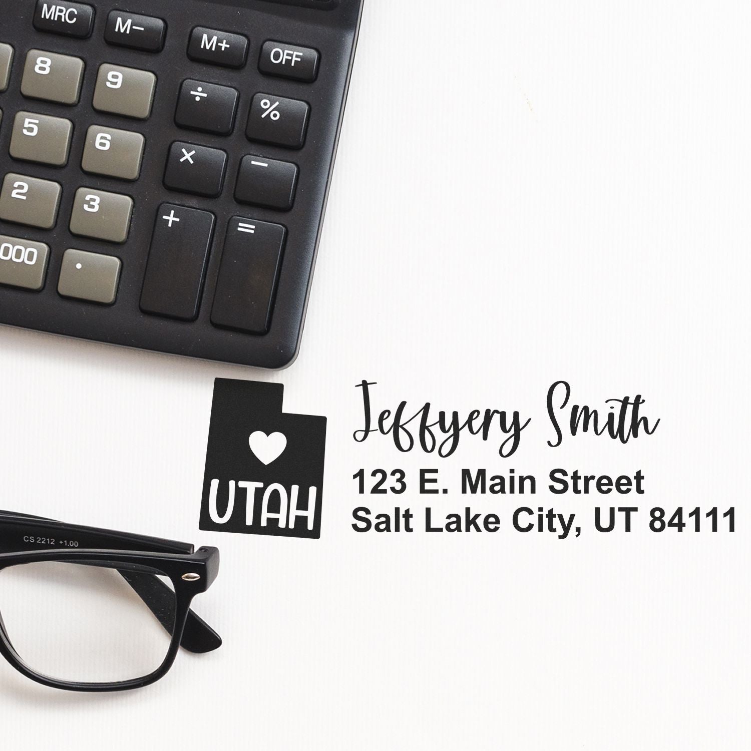 Personalized return address rubber stamp with Utah logo, name, and mailing address for business mailings.