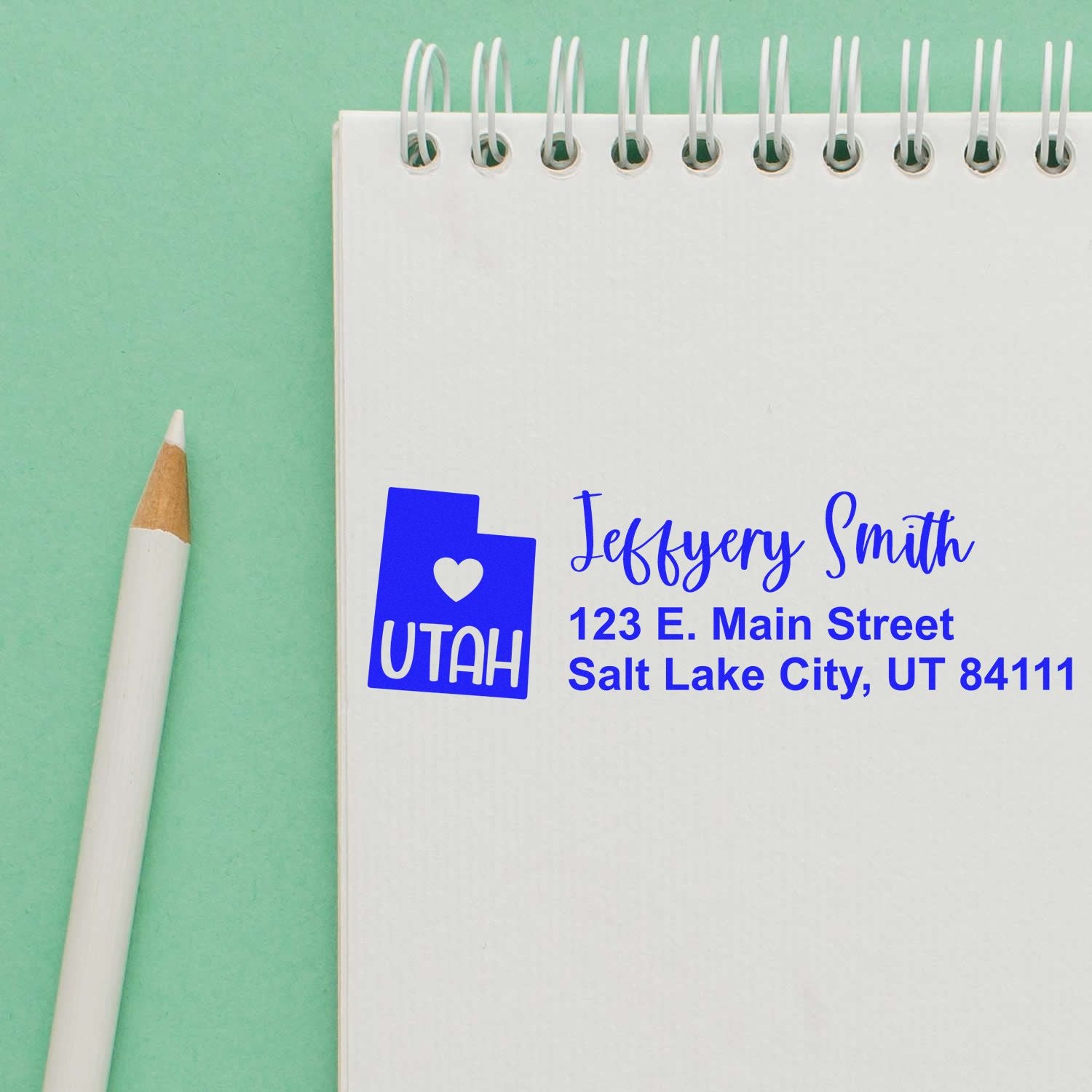 Custom return address rubber stamp featuring Utah icon, name, and address for envelopes and mailing.
