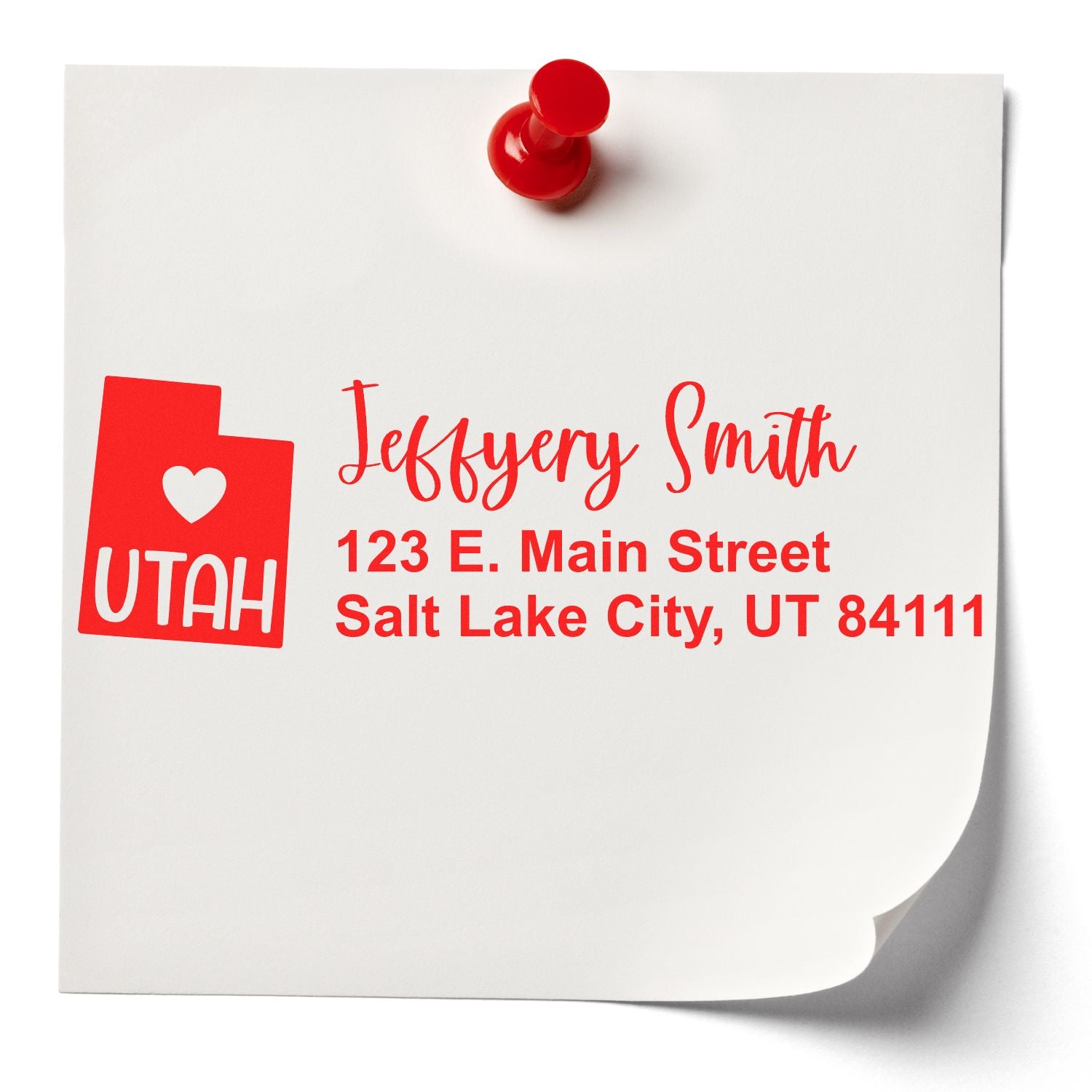 Custom Utah return address rubber stamp with name and Salt Lake City address printed in red on paper.