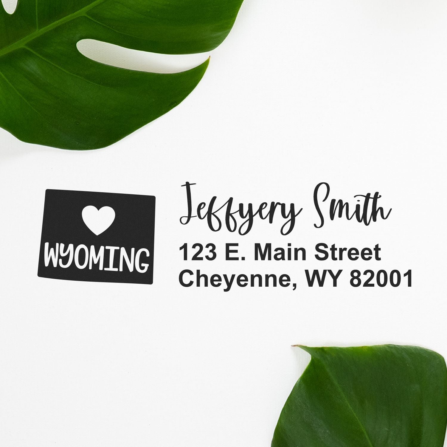 Custom return address rubber stamp with Wyoming heart icon for Jeffrey Smith, 123 E. Main Street, Cheyenne, WY 82001.