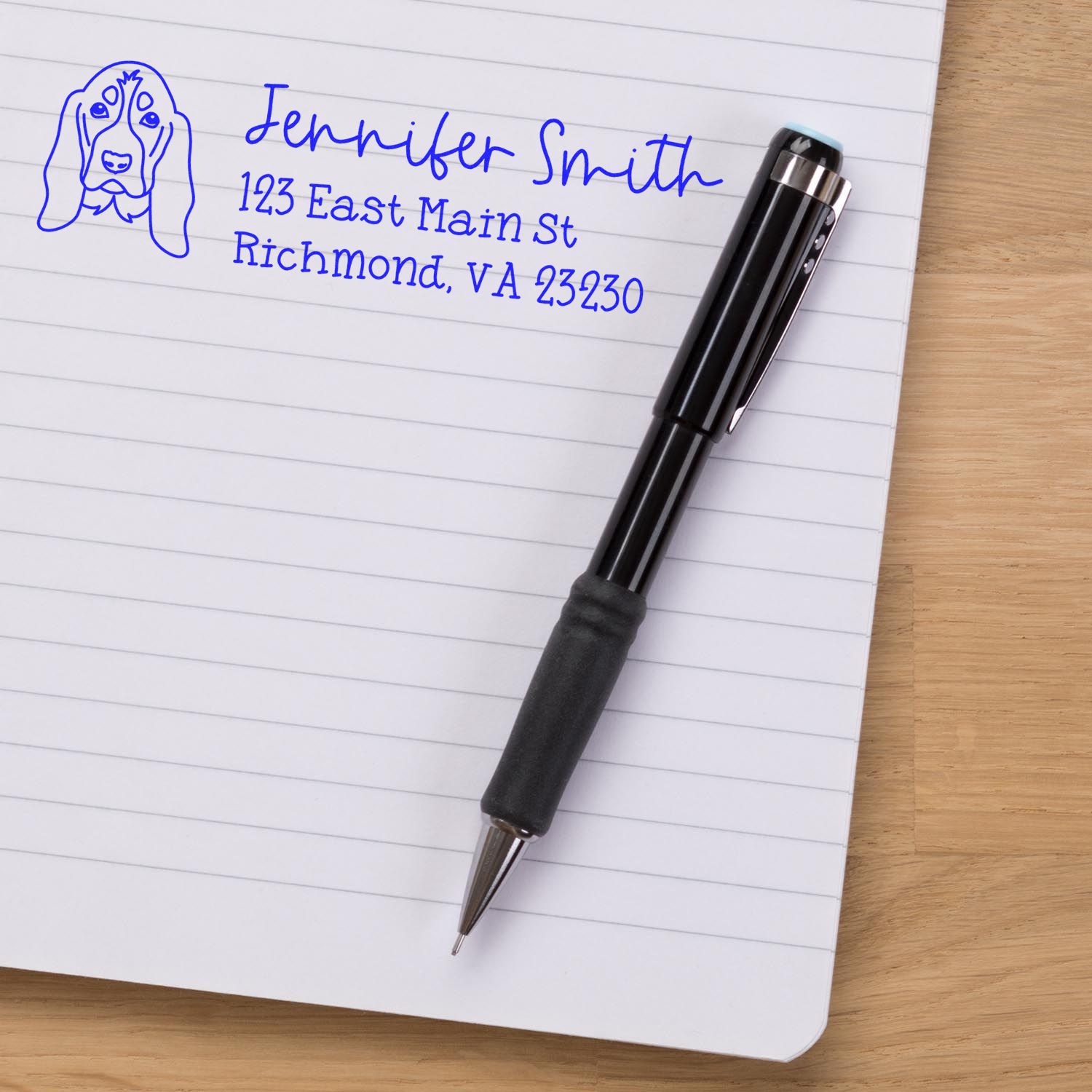 Custom dog return address rubber stamp impression on notebook with pen, featuring name and Richmond, VA address.