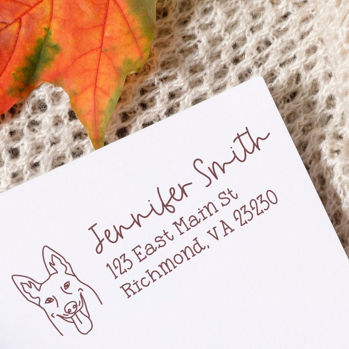 Personalized rubber stamp return address for Jennifer Smith, Richmond, VA, with dog logo on white paper.