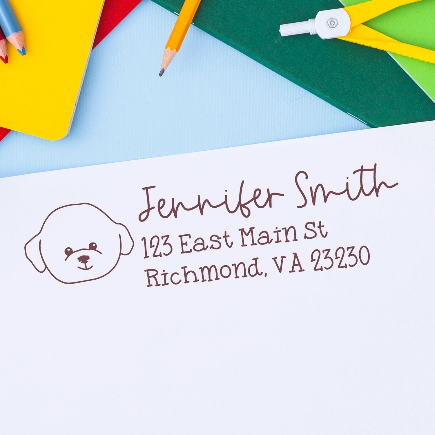 Custom return address rubber stamp with dog icon on envelope, showing Jennifer Smiths name and Richmond, VA address.