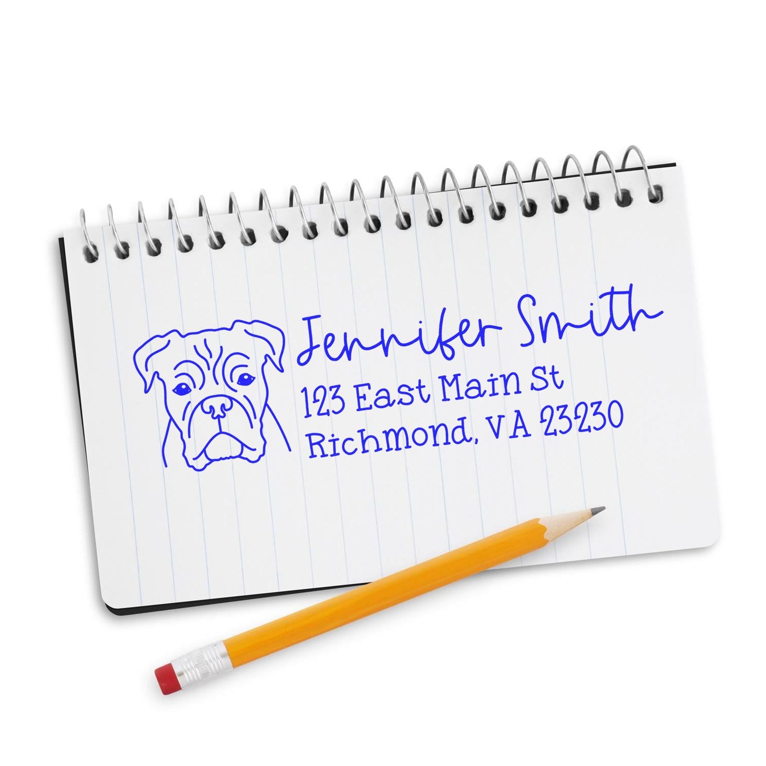 Custom rubber return address stamp with dog logo, Jennifer Smith, Richmond VA, on spiral notebook paper.