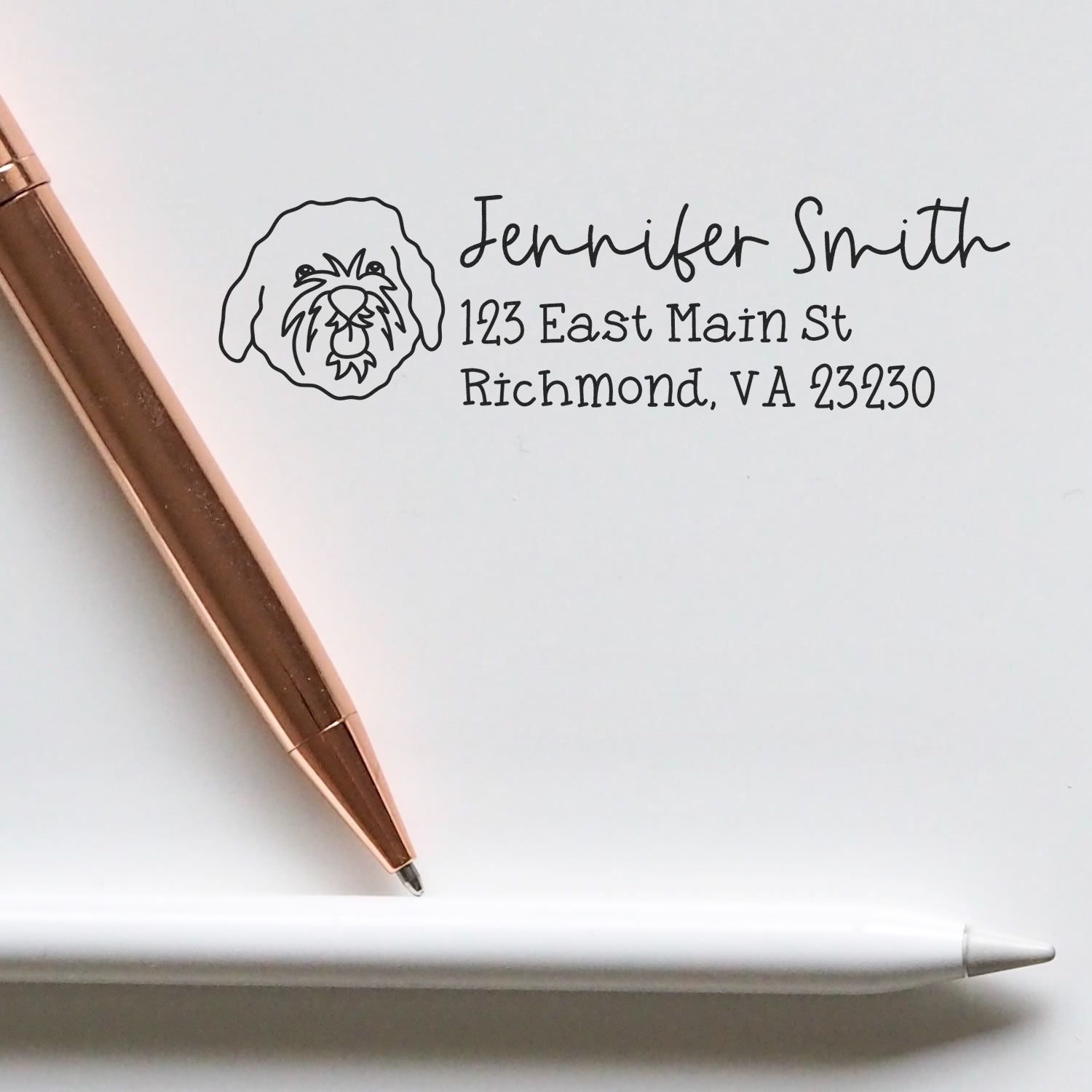 Custom dog address rubber stamp with name and return address for personalized envelopes and stationery.