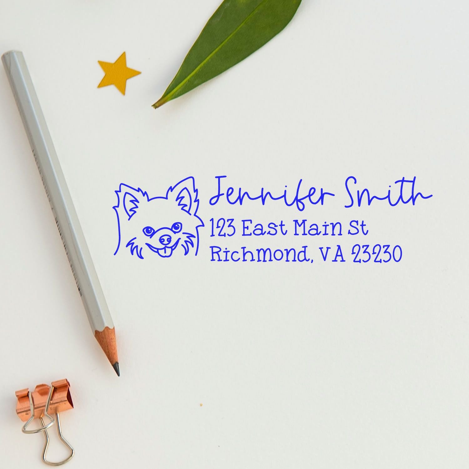 Personalized dog return address rubber stamp with name and address in blue ink on stationery