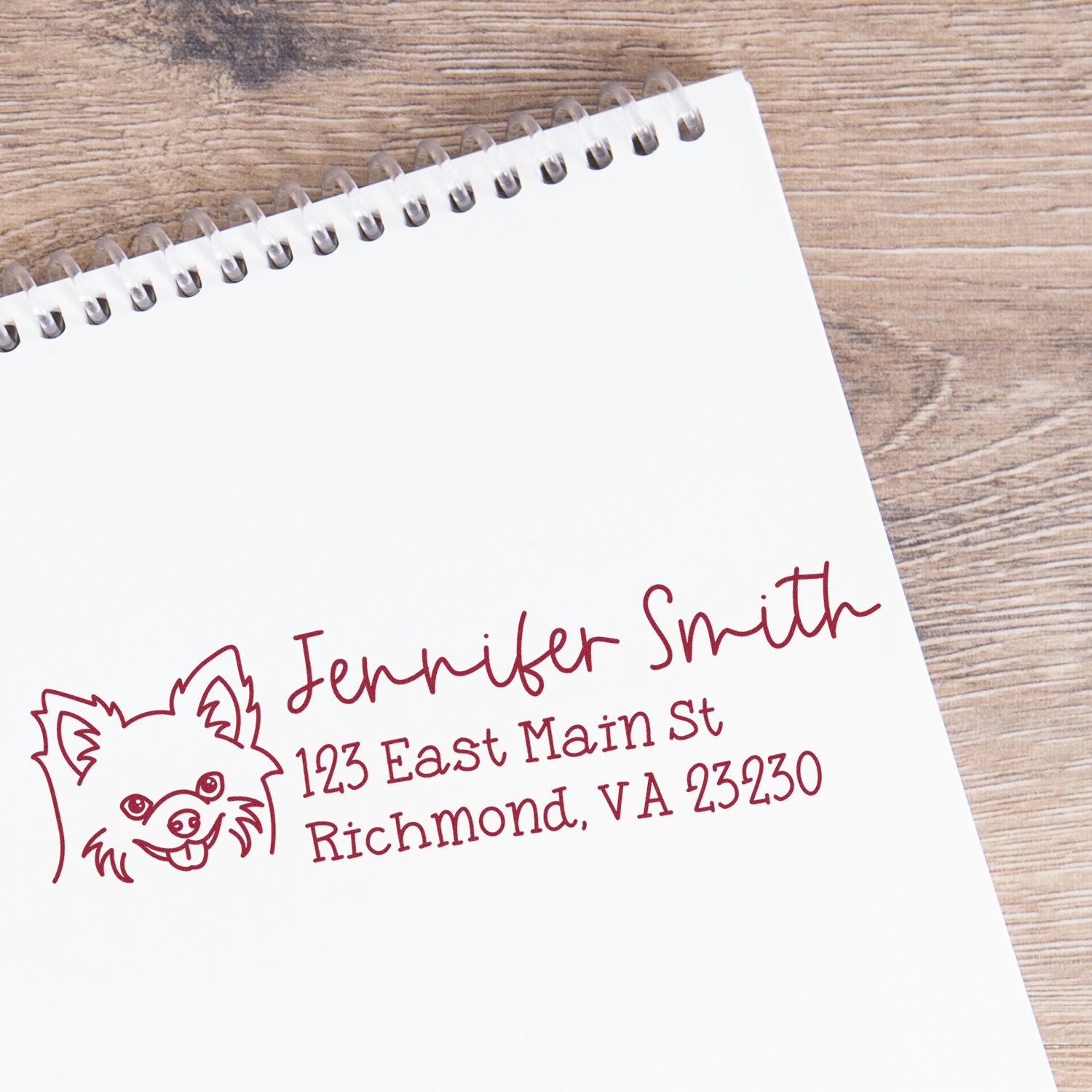 Custom return address rubber stamp with dog icon, Jennifer Smith name, and Richmond, VA address on notebook paper.