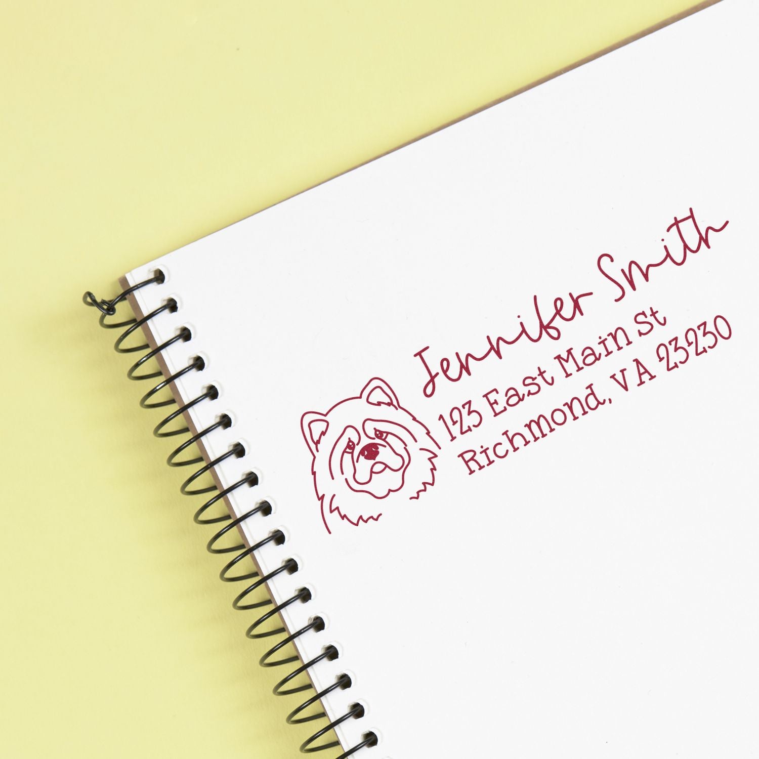 Custom rubber address stamp with dog illustration for Jennifer Smith, 123 East Main St, Richmond, VA 23230.