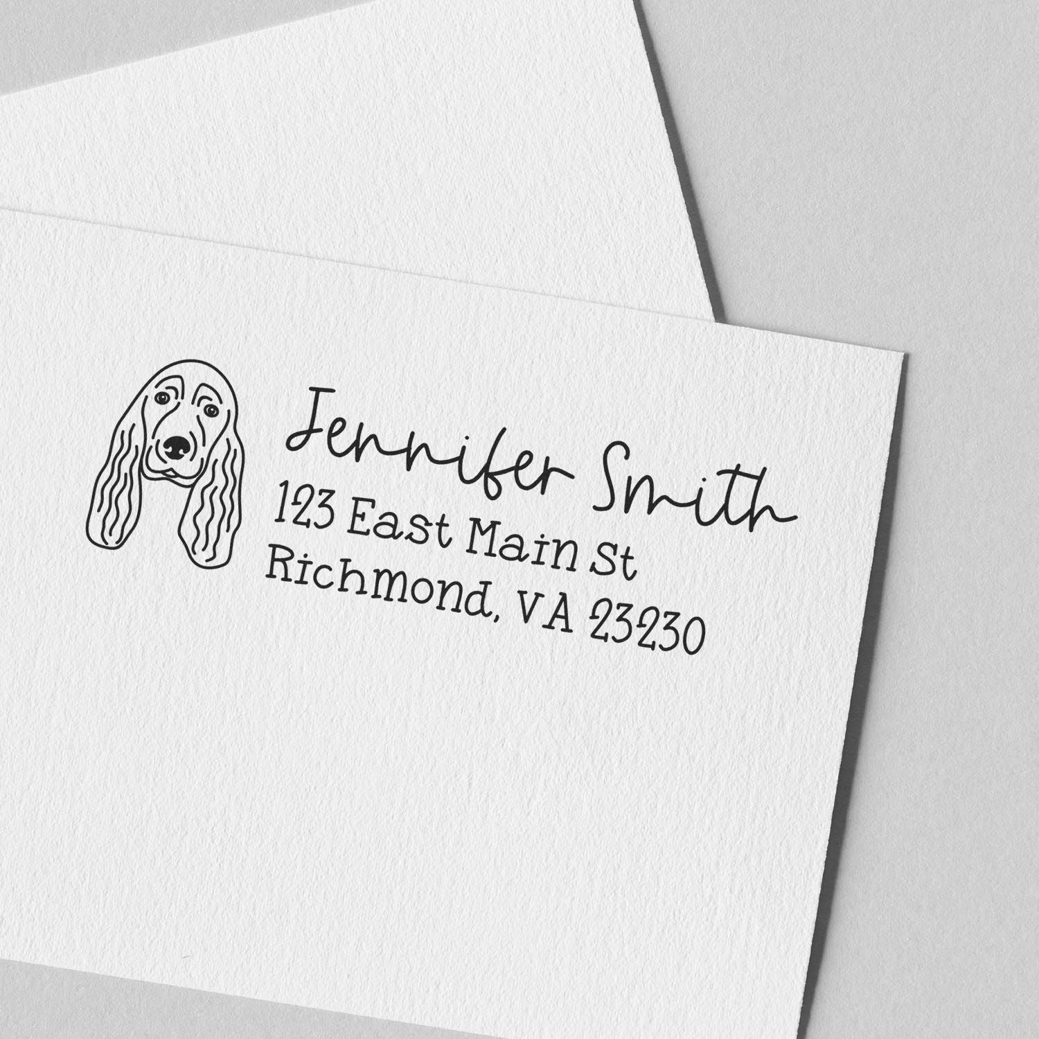 Custom return address rubber stamp with dog illustration for personalized envelopes and stationery.