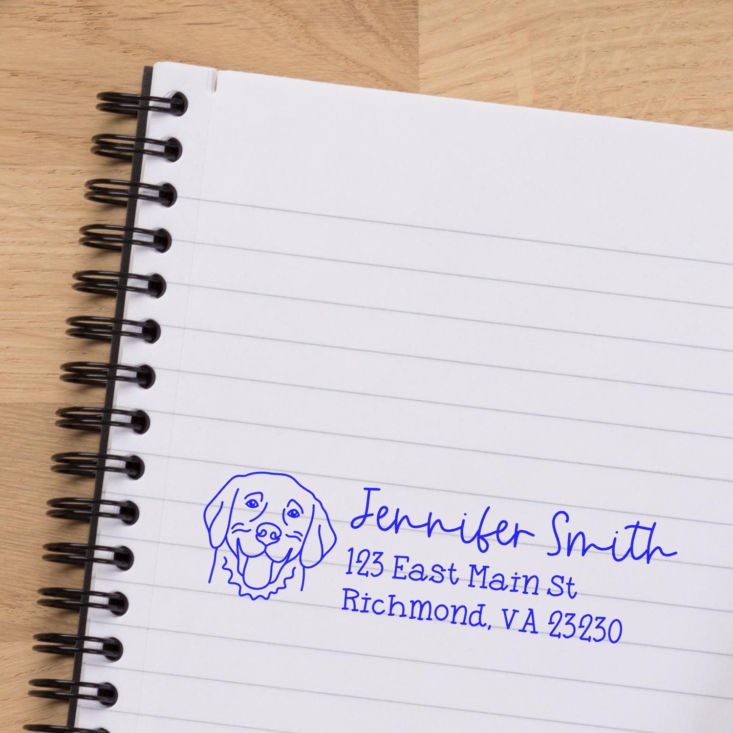 Personalized dog return address rubber stamp imprint with name and Richmond, VA address on notebook page.