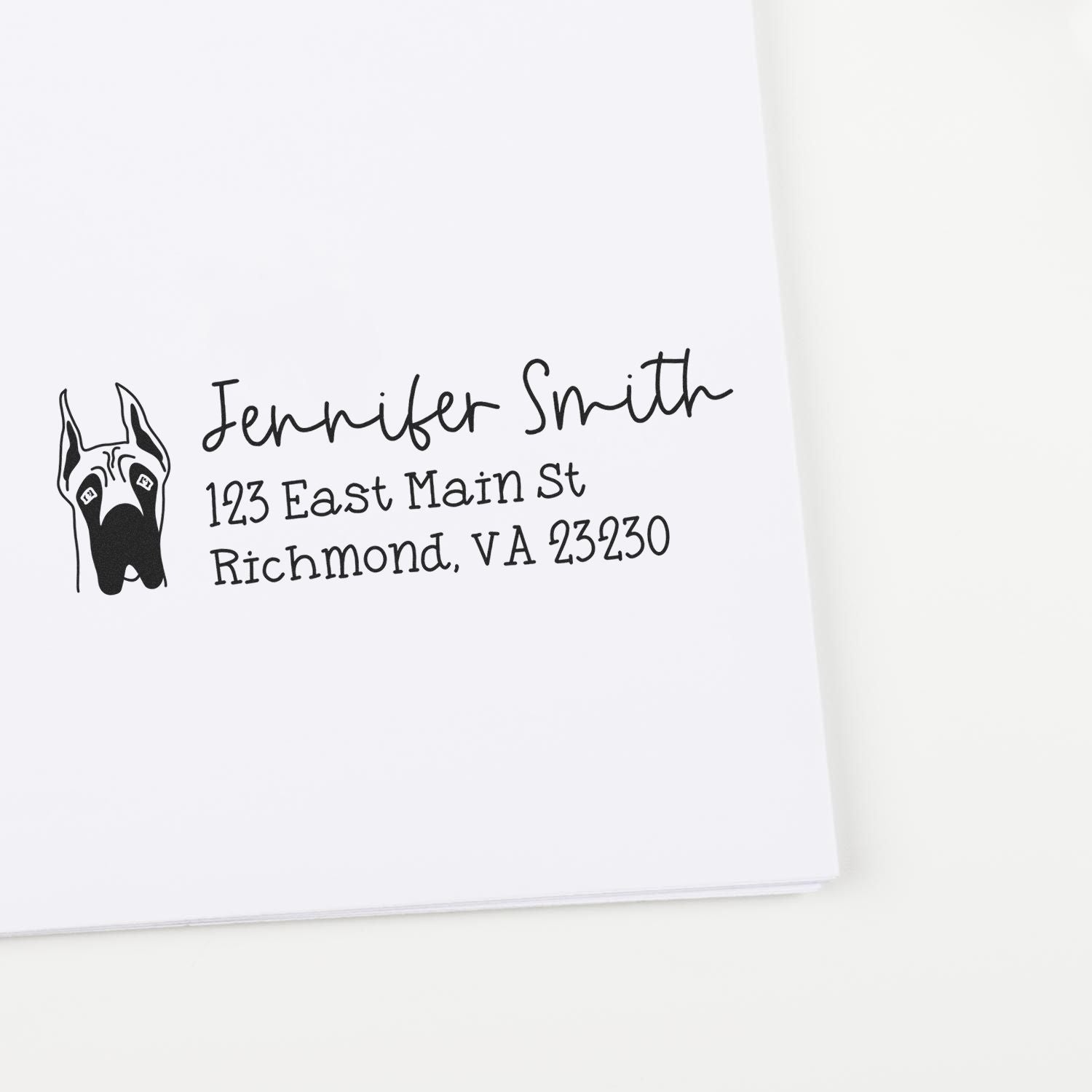 Custom dog address rubber stamp with Jennifer Smith, 123 East Main St, Richmond, VA 23230.