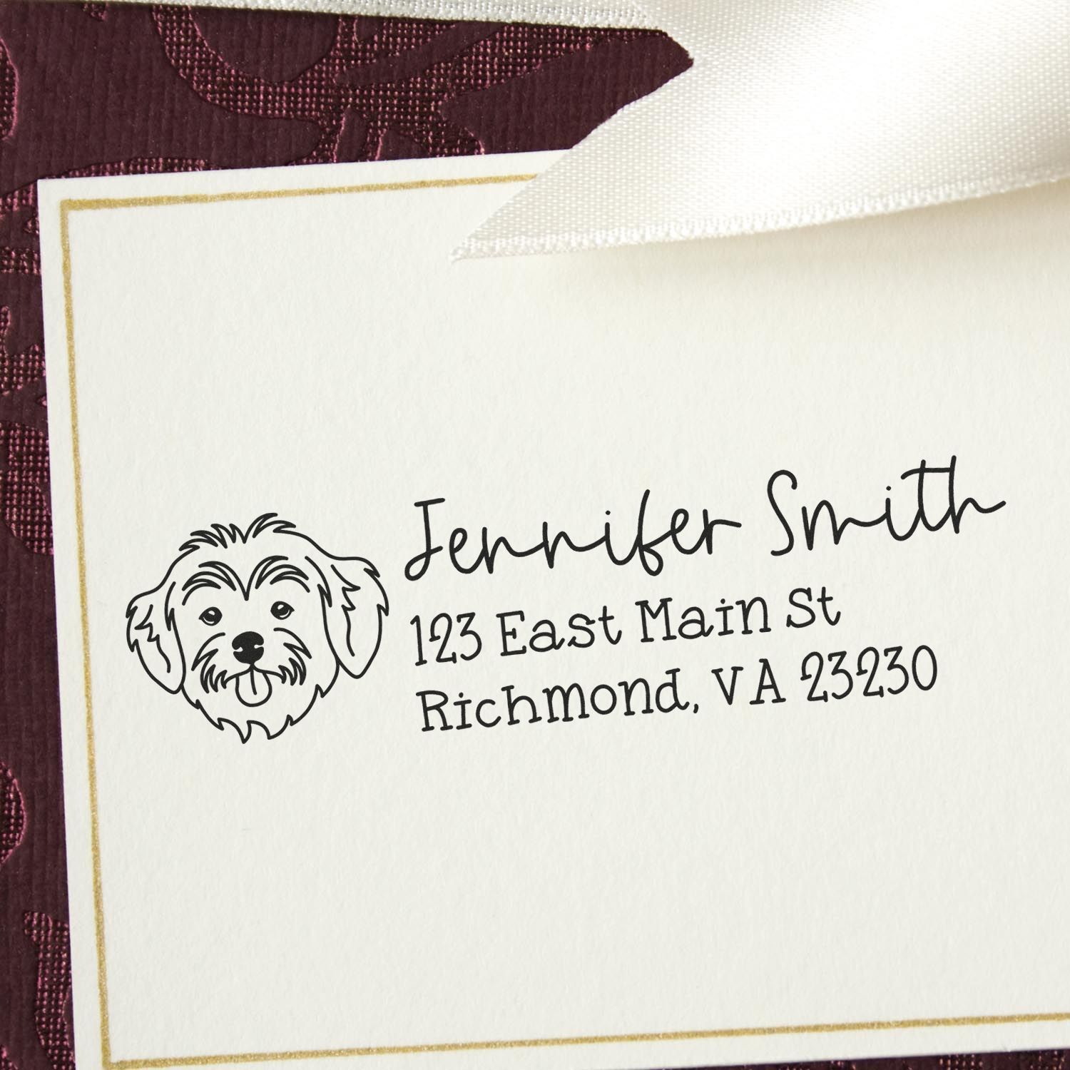 Personalized rubber address stamp with dog icon for Jennifer Smith, Richmond, VA on stationery.