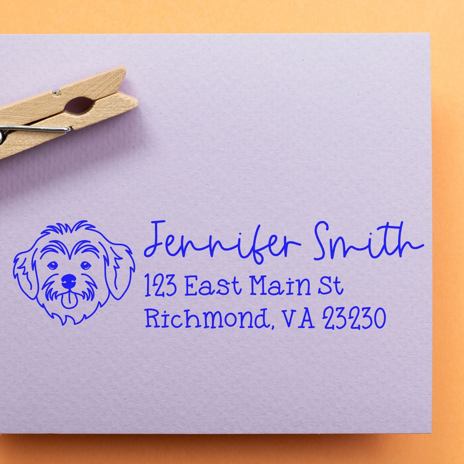 Personalized dog address rubber stamp with pet portrait, name, and Richmond, VA return address in blue ink.