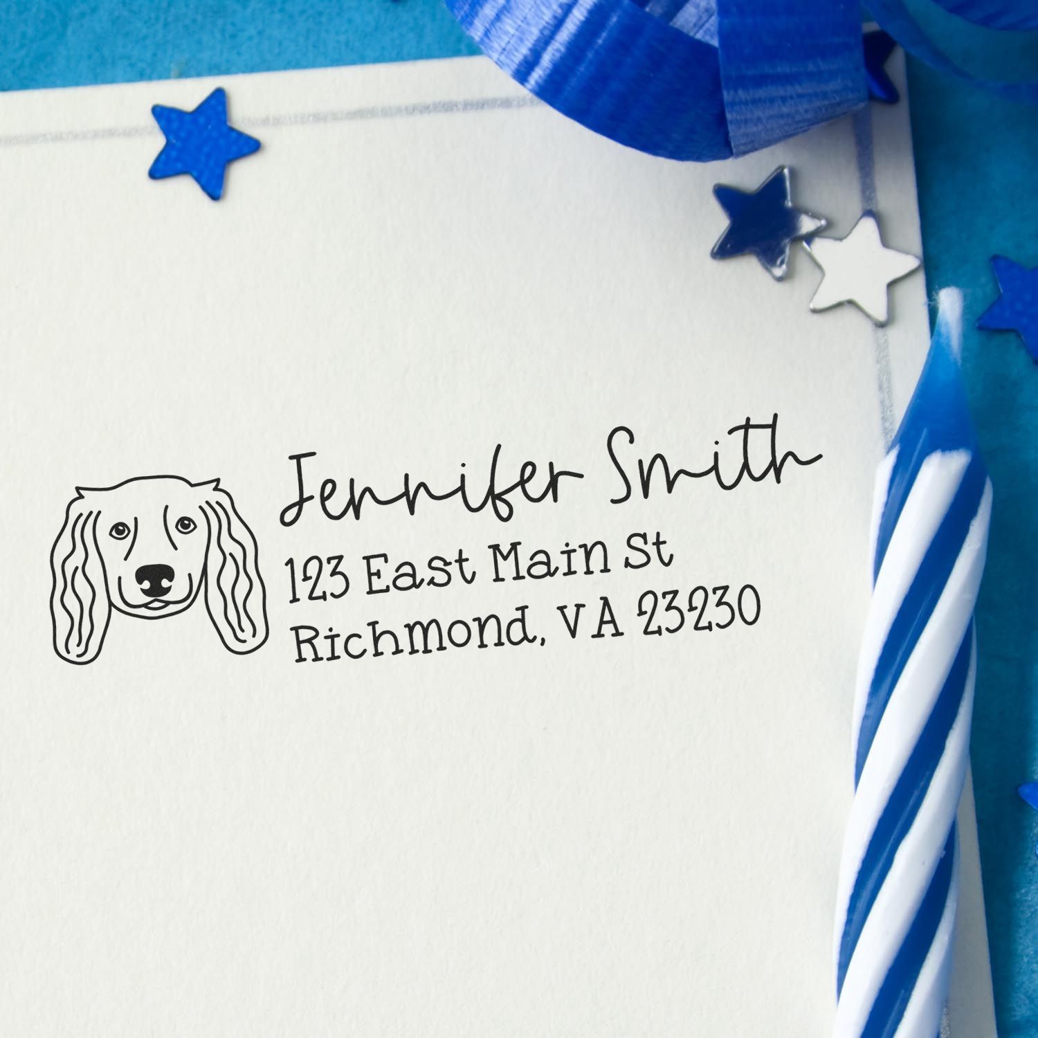 Personalized dog address rubber stamp on envelope with name and Richmond, VA address, styled with blue stars and ribbon.