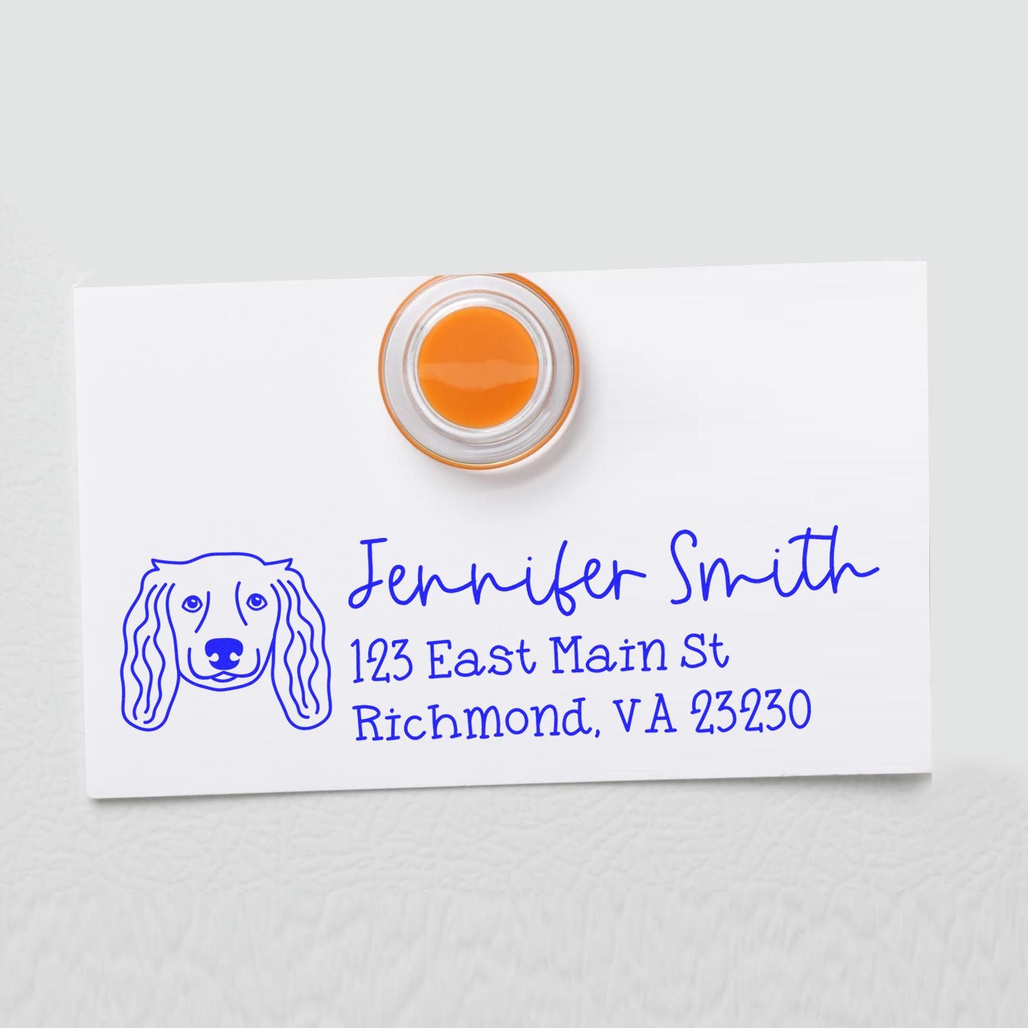 Custom rubber address stamp with dog illustration for personalized pet stationery and mailing labels.