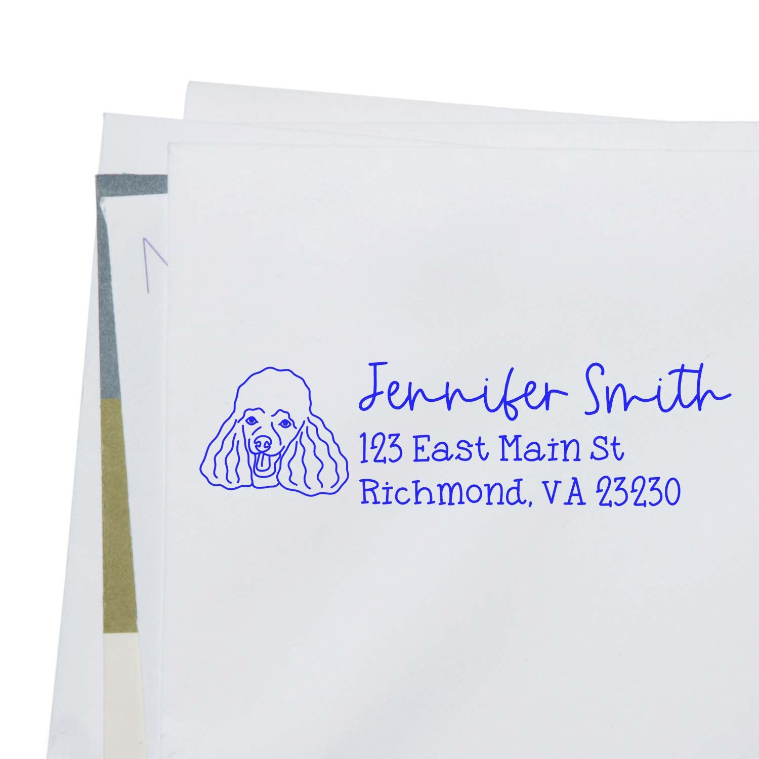 Personalized rubber address stamp with poodle design and blue return address for envelopes