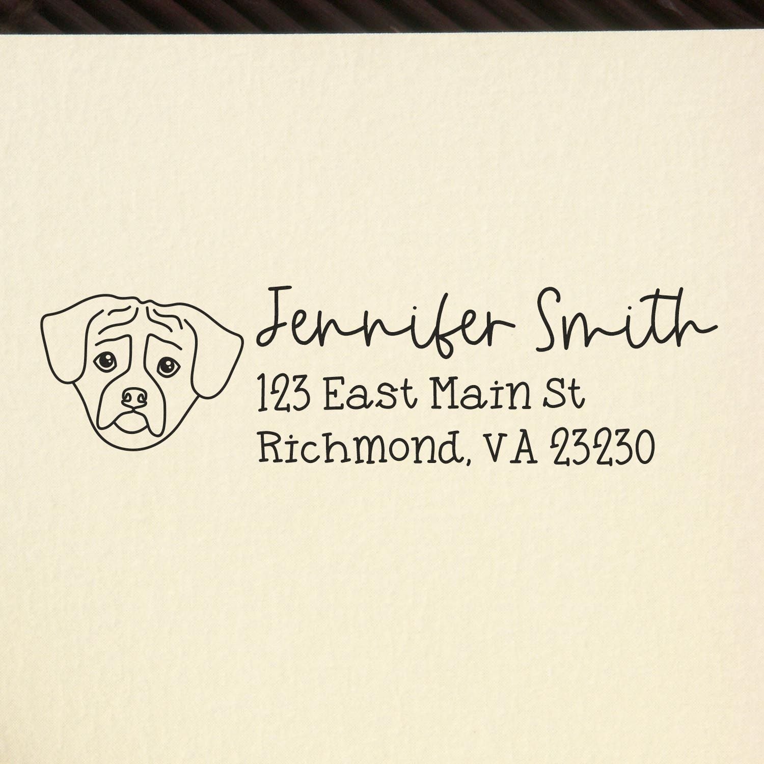 Custom rubber return address stamp with dog illustration for Jennifer Smith, 123 East Main St, Richmond, VA 23230.